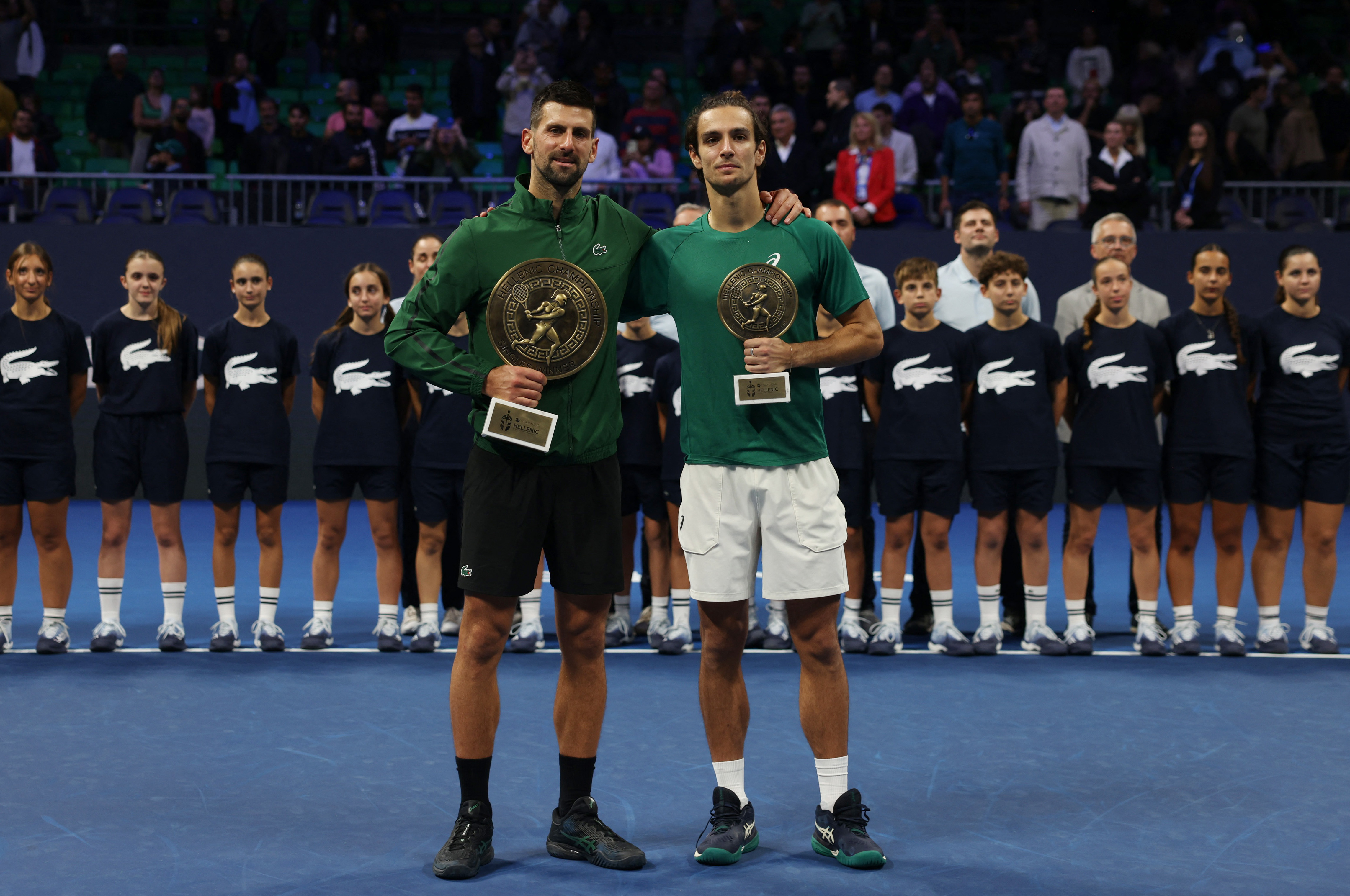 Novak Djokovic and Lorenzo Musetti react.