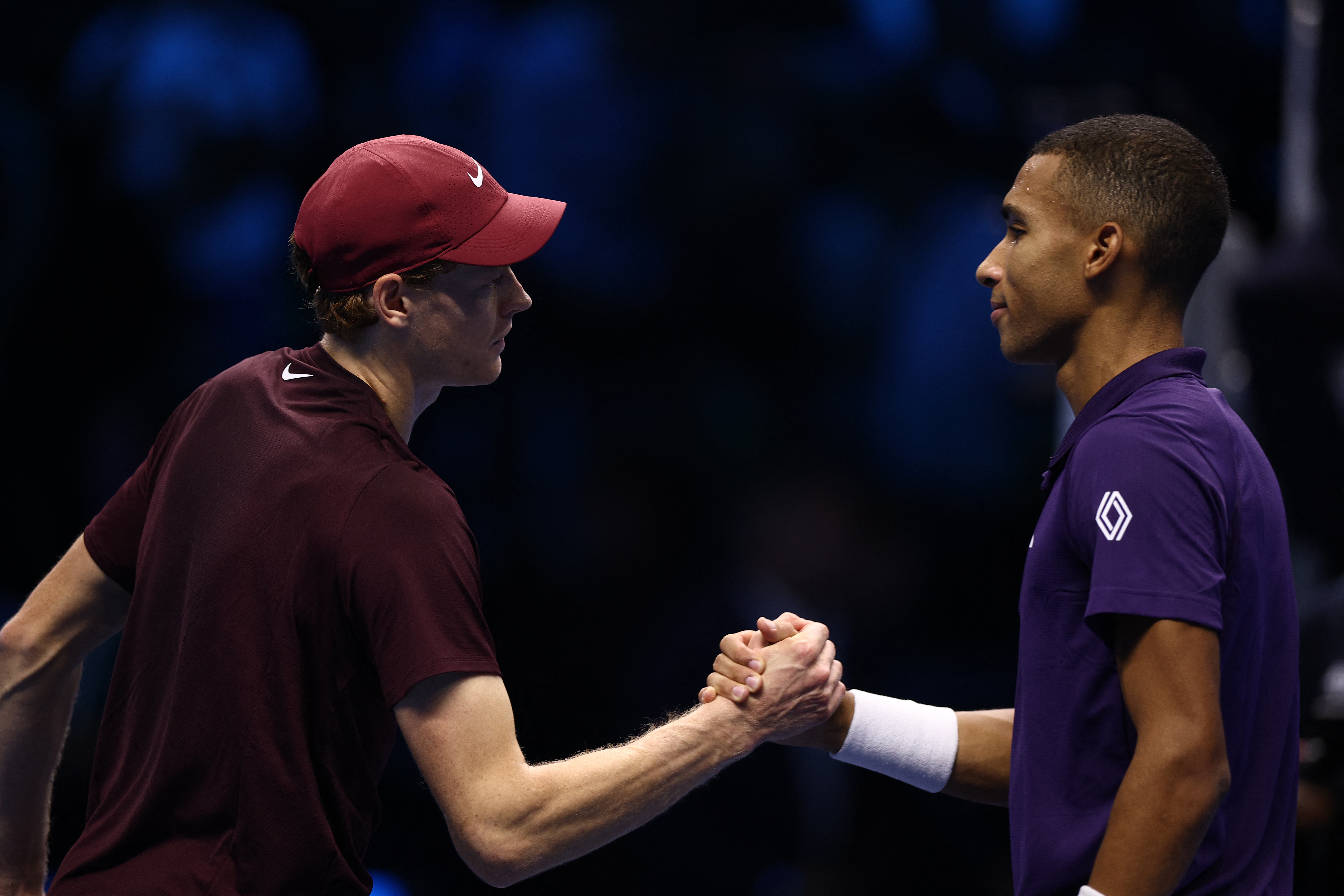Jannik Sinner and Felix Auger-Aliassime react.
