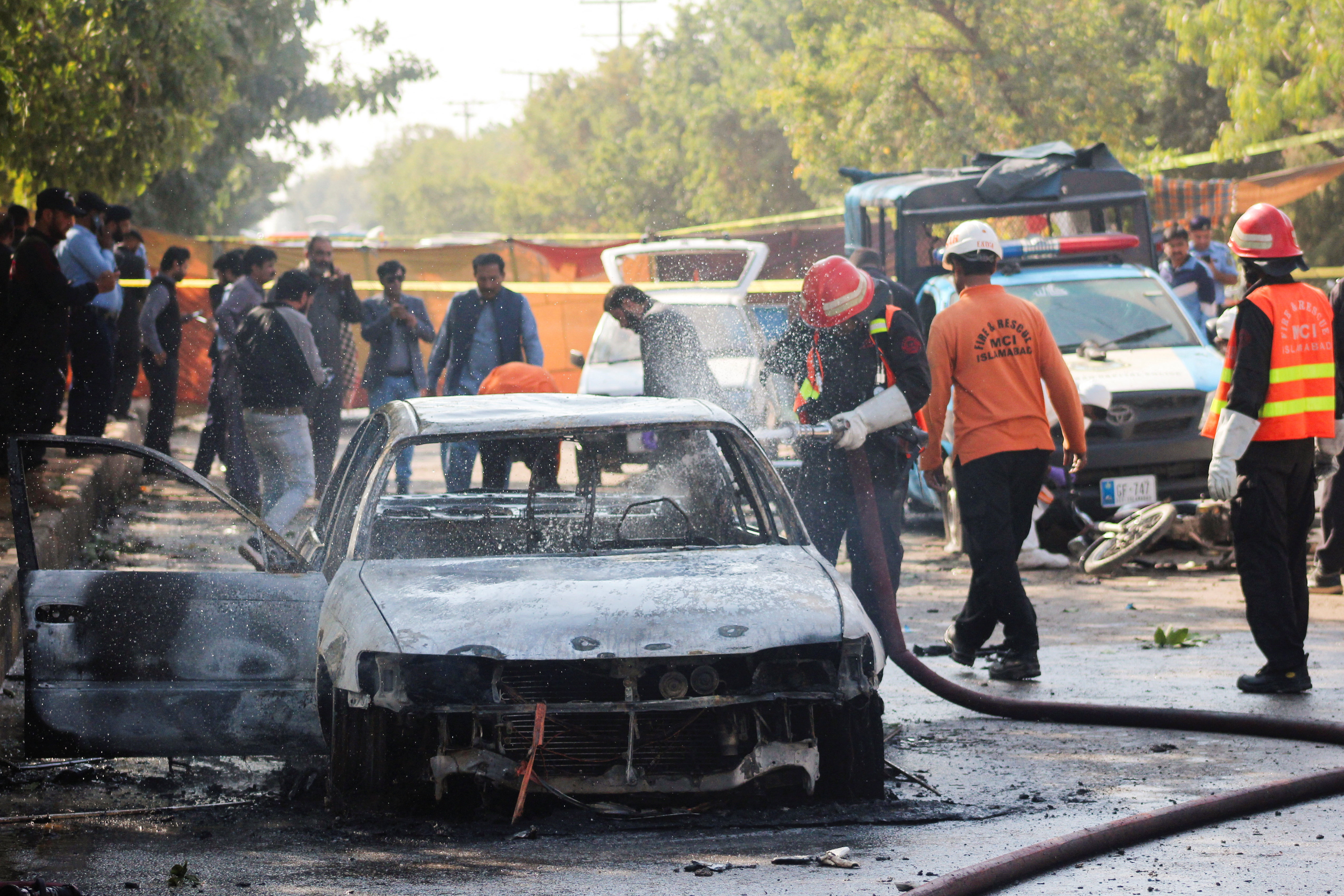 Burned out car at bomb site.