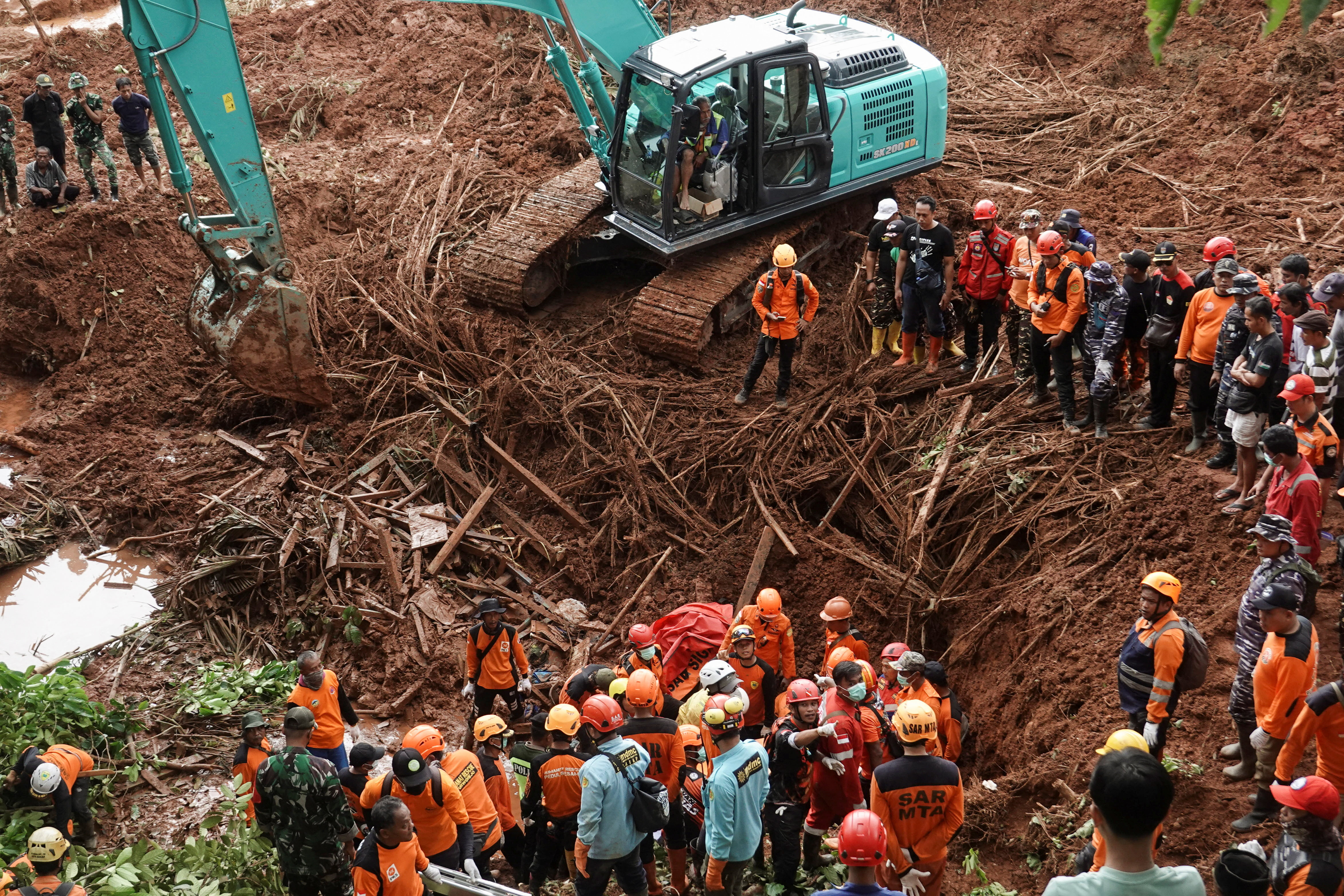 Indonesian rescue members search for victims