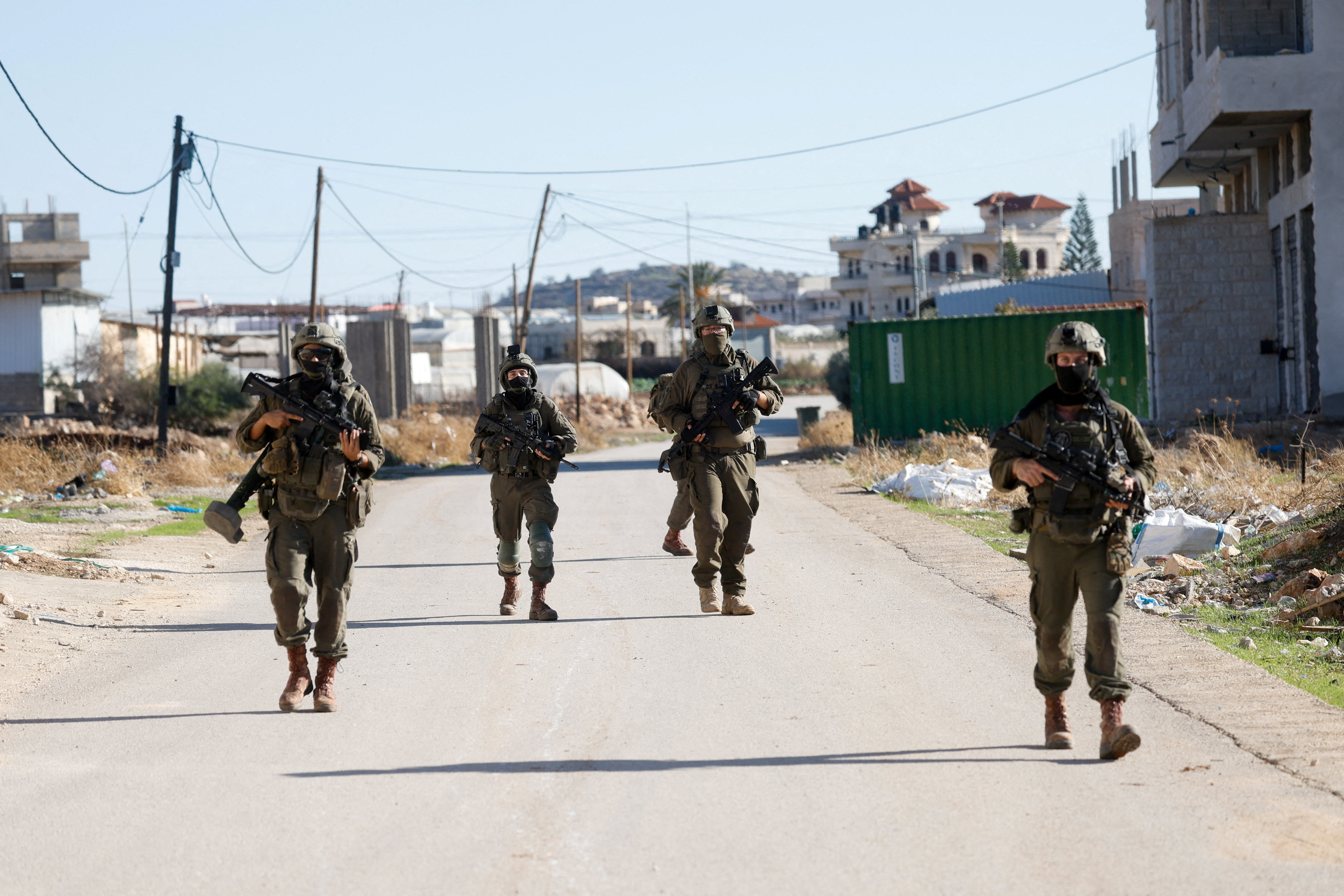 Israeli soldiers walk in Tubas during a wide-scale raid