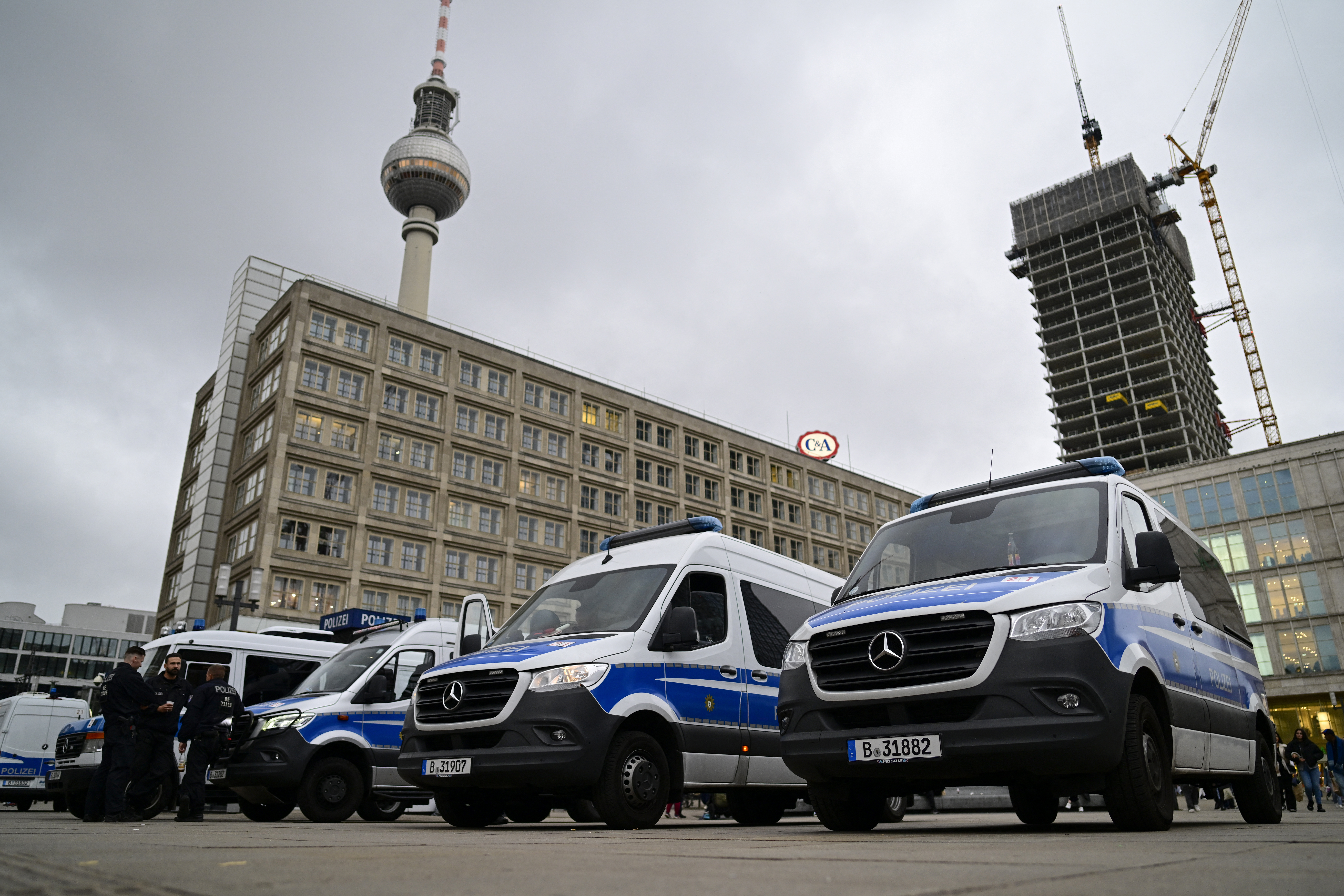 German police position themselves at Berlin's Alexanderplatz square on October 7, 2025.