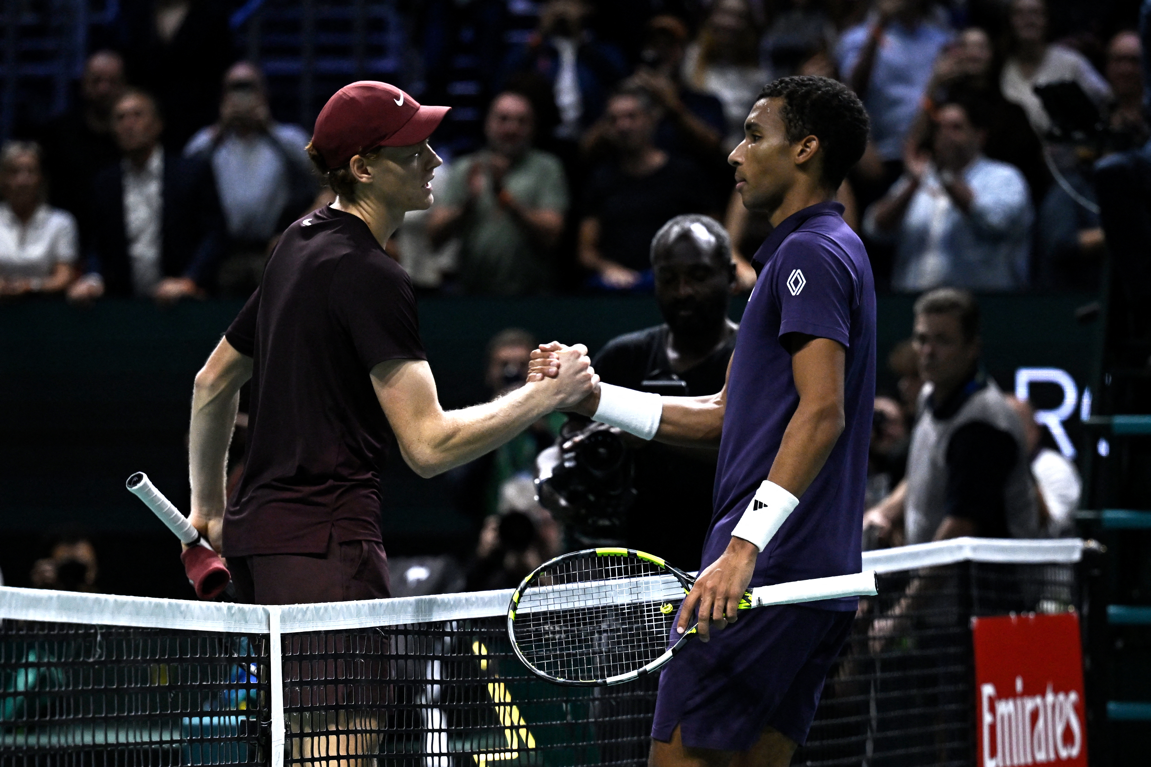 Jannik Sinner and Felix Auger-Aliassime react.