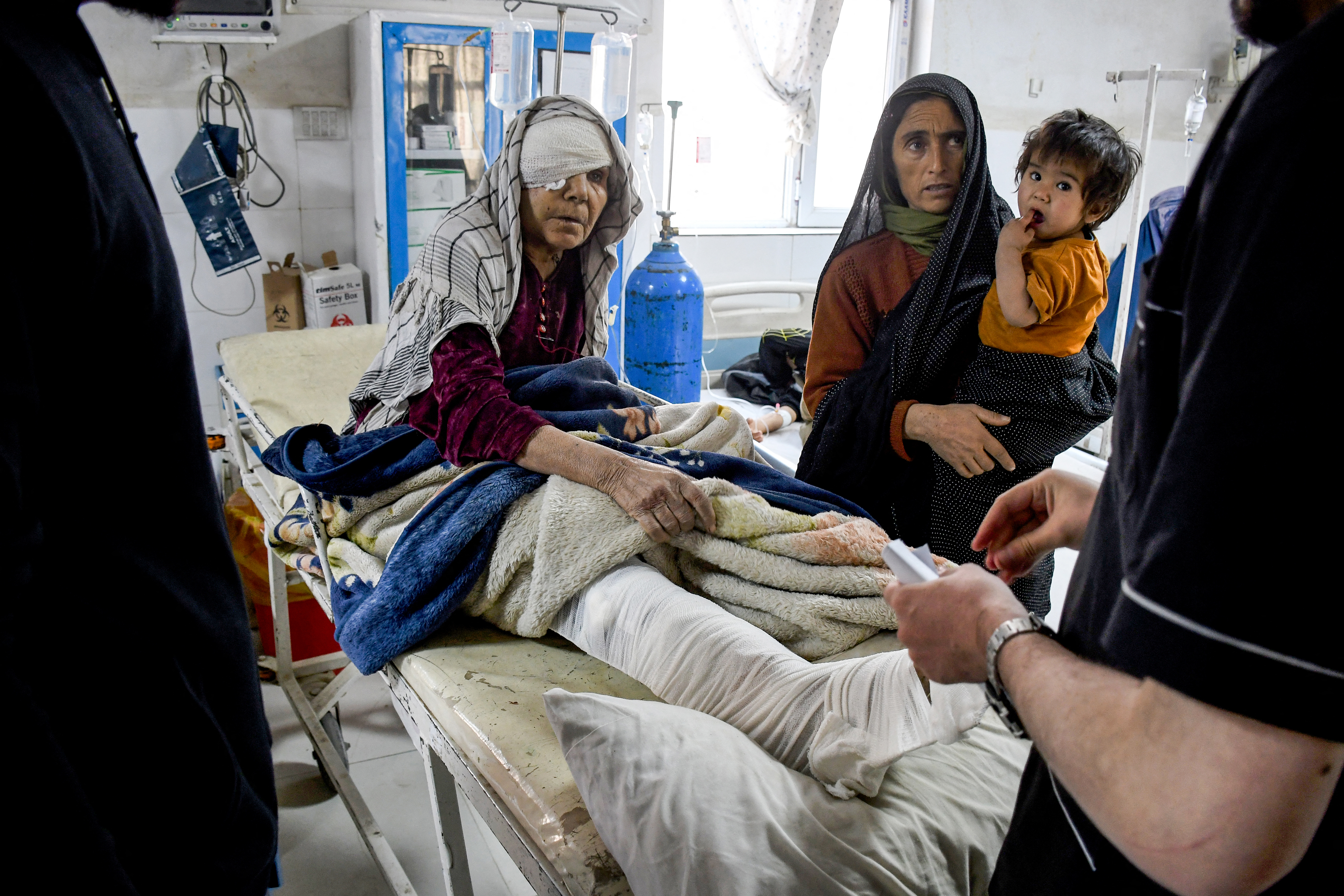 An injured Afghan woman receives treatment at a hospital.