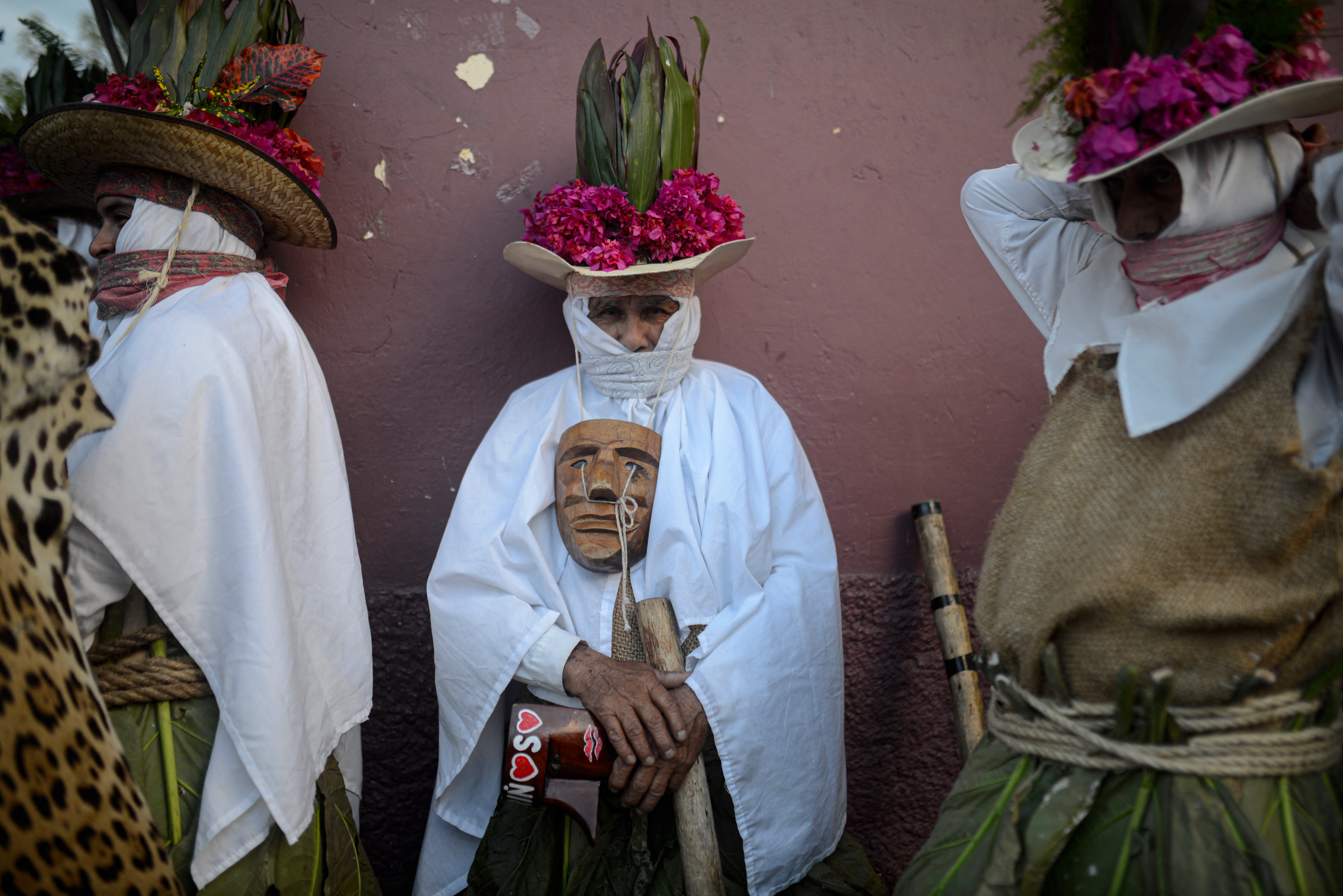 People take part in the National Dancing Masks Festival in Coscomatepec de Bravo, Veracruz state, Mexico