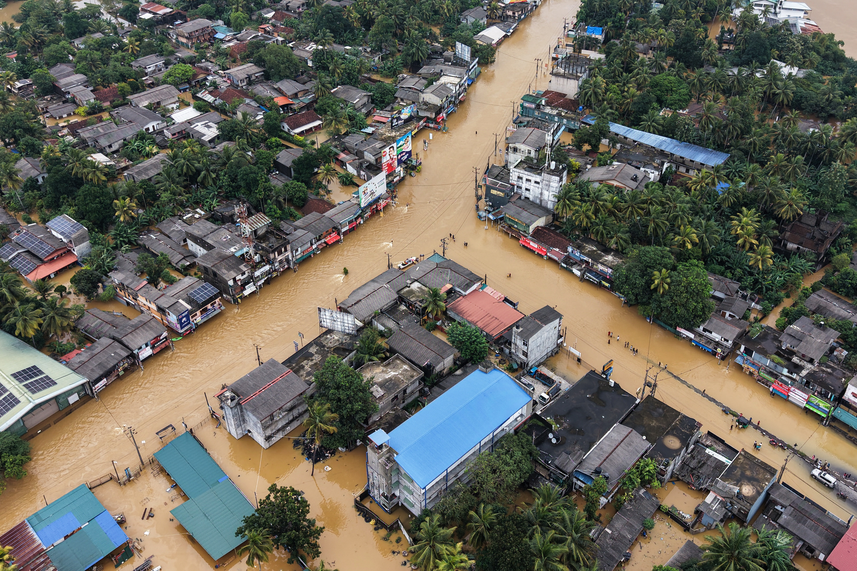 An aerial view shows houses partially submerged in floodwaters after heavy rainfall in Kaduwela on the outskirts of Colombo