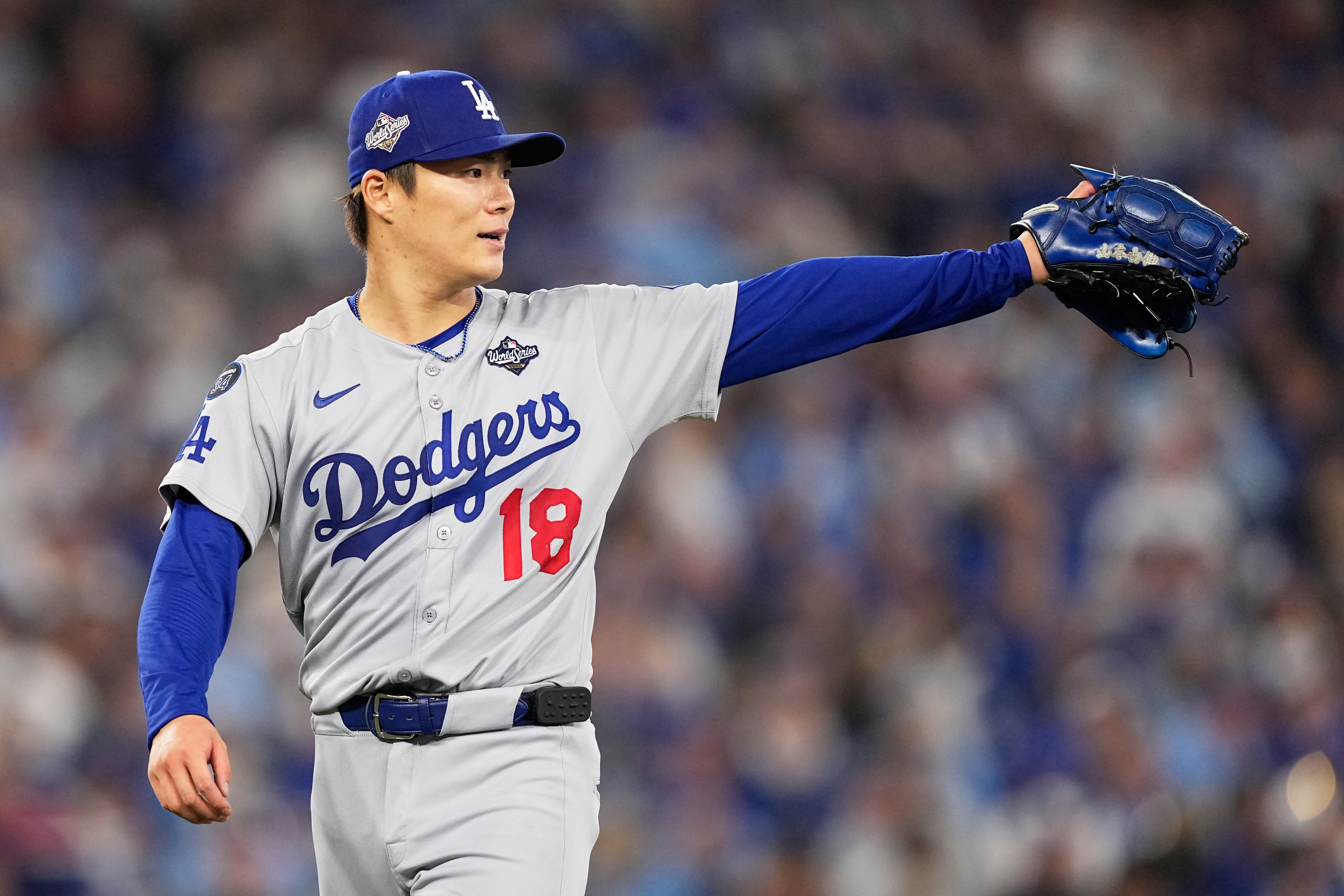 Los Angeles Dodgers pitcher Yoshinobu Yamamoto gestures during a game.