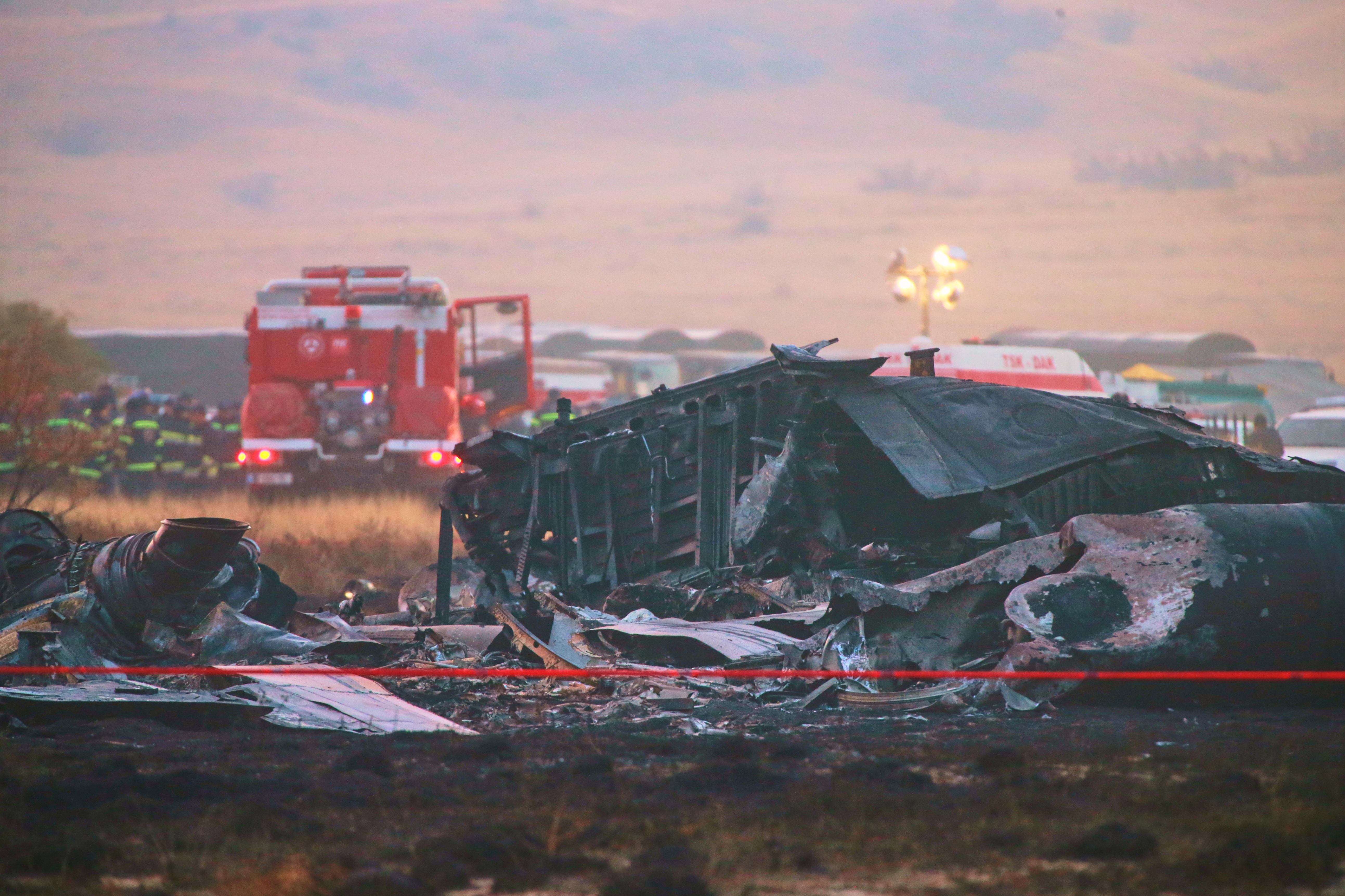Debris is seen at a crash site of a Turkish military cargo plane in Georgia's Sighnaghi municipality, close to the Azerbaijani border
