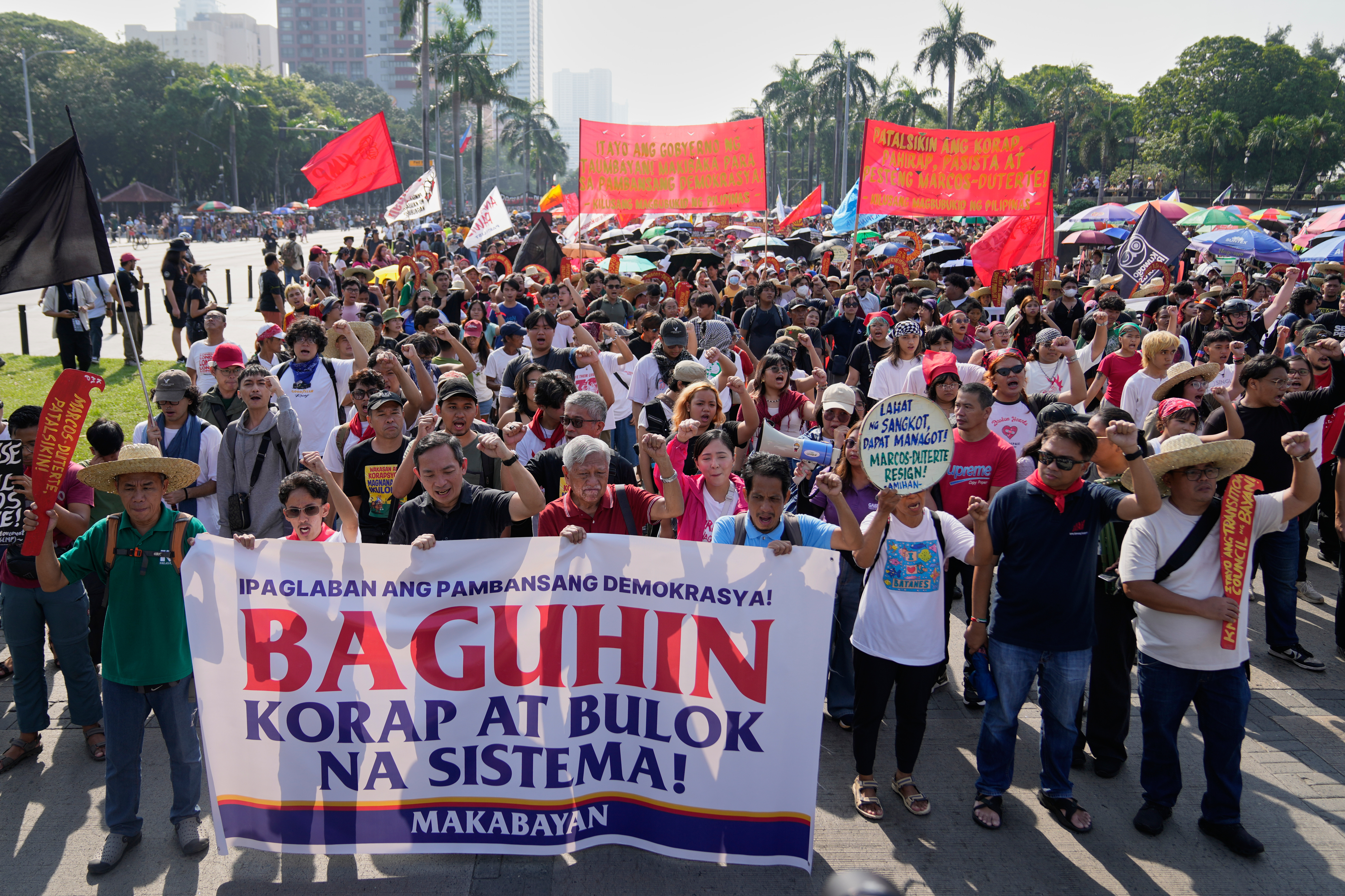 Protesters shout slogans during anti-corruption protest in Manila, Philippines on Sunday Nov. 30, 2025. (AP Photo/Aaron Favila)