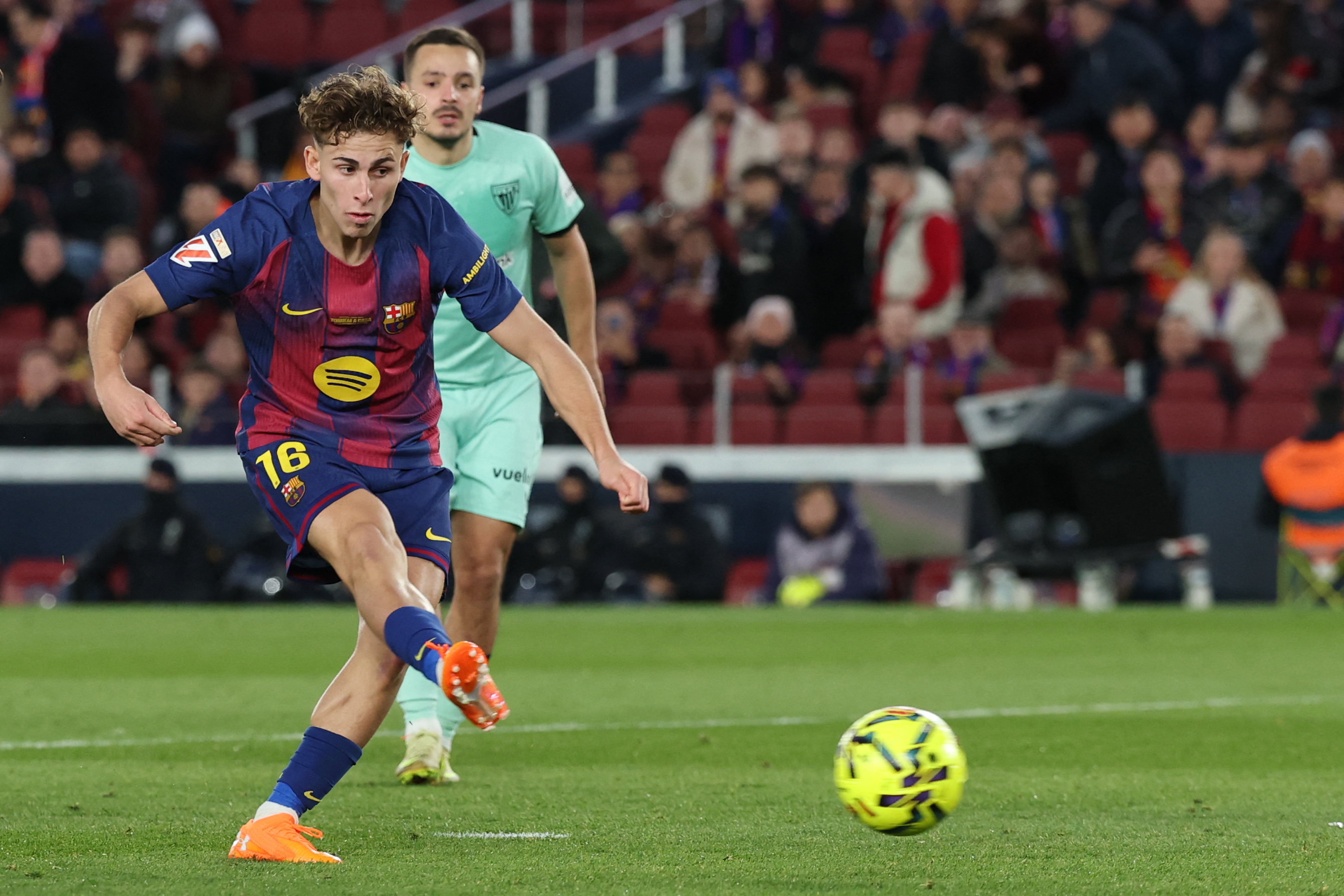 Barcelona's Spanish midfielder #16 Fermin Lopez scores his team's third goal during the Spanish league football match between FC Barcelona and Athletic Club Bilbao at Camp Nou Stadium in Barcelona on November 22, 2025. (Photo by Lluis GENE / AFP)