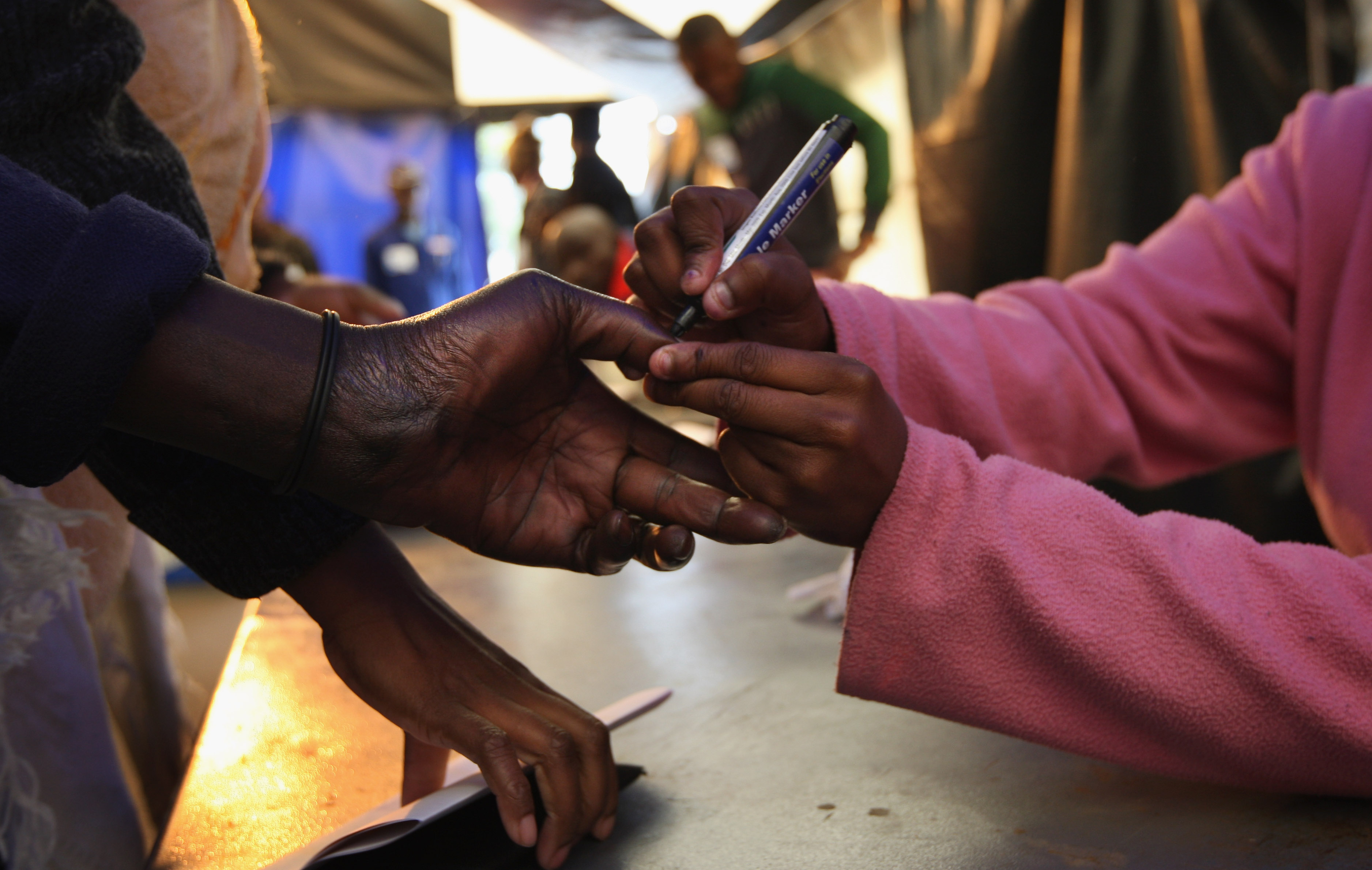 ALEXANDRA TOWNSHIP, SOUTH AFRICA - APRIL 22: A woman's hand is marked with ink before casting her ballot in national elections April 22, 2009 in Alexandra Township, South Africa. The ruling African National Congress was favored to win the majority of seats in the national assembly during Wednesday's vote, although rival parties are expected to make their best showing since the ANC took power in 1994. (Photo by John Moore/Getty Images)