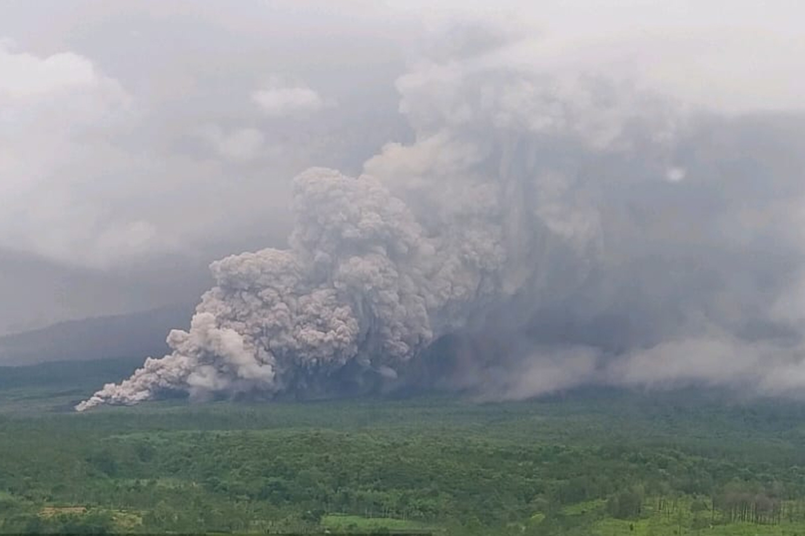 In this photo released by the Geological Agency (Badan Geologi) of Indonesia's Ministry of Energy and Mineral Resources, Mount Semeru releases volcanic materials during an eruption in Lumajang, East Java, Indonesia, Wednesday, Nov. 19, 2025. [Badan Geologi/AP]