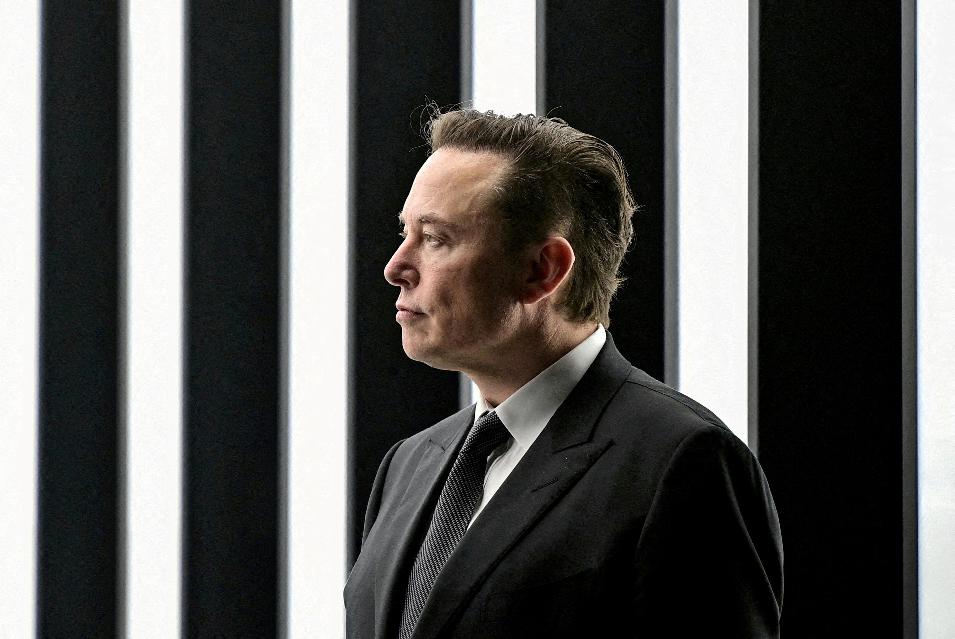 FILE PHOTO: Elon Musk attends the opening ceremony of the new Tesla Gigafactory for electric cars in Gruenheide, Germany, March 22, 2022. Patrick Pleul/Pool via REUTERS/File Photo/File Photo