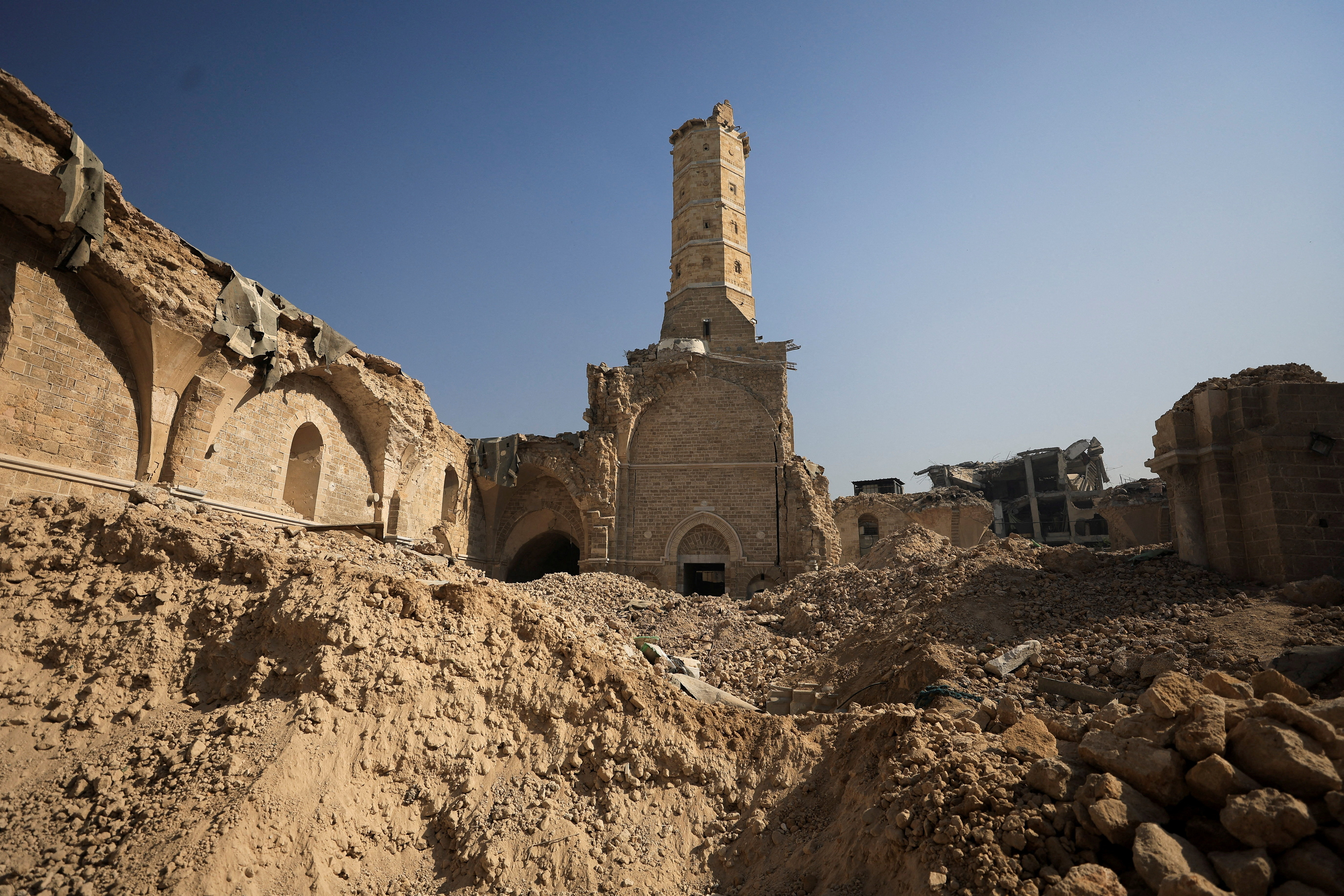 A view of Omari Mosque, which was damaged by Israeli shelling during the war, where Palestinians perform Friday prayers, in Gaza City, November 21, 2025. REUTERS/Dawoud Abu Alkas