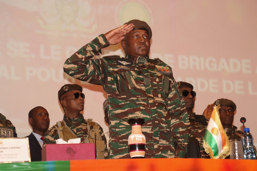 The head of Niger's military regime, General Abdourahamane Tiani (C) attends conference on February 15, 2025. [File:AFP)