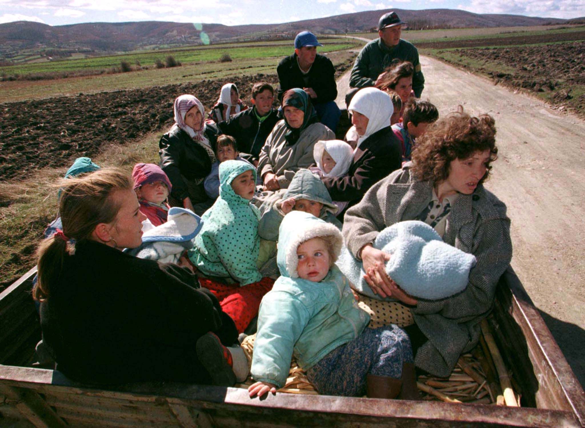 An ethnic Albanian refugee from Kosovo's village of Prekaz sits in a trailer as holds her baby in a field near the village March 6. Serbian police battling heavily armed Albanians nationalists in their mountain strongholds of central Kosovo on Friday met fierce resistance and casualties were high, Serb sources said. Fighting was concentrated around the villages of Prekaz and Lausha where Albanian informants claimed 50 nationalists were killed on Thursday, more than double the official toll given by police. (HUNGARY OUT)