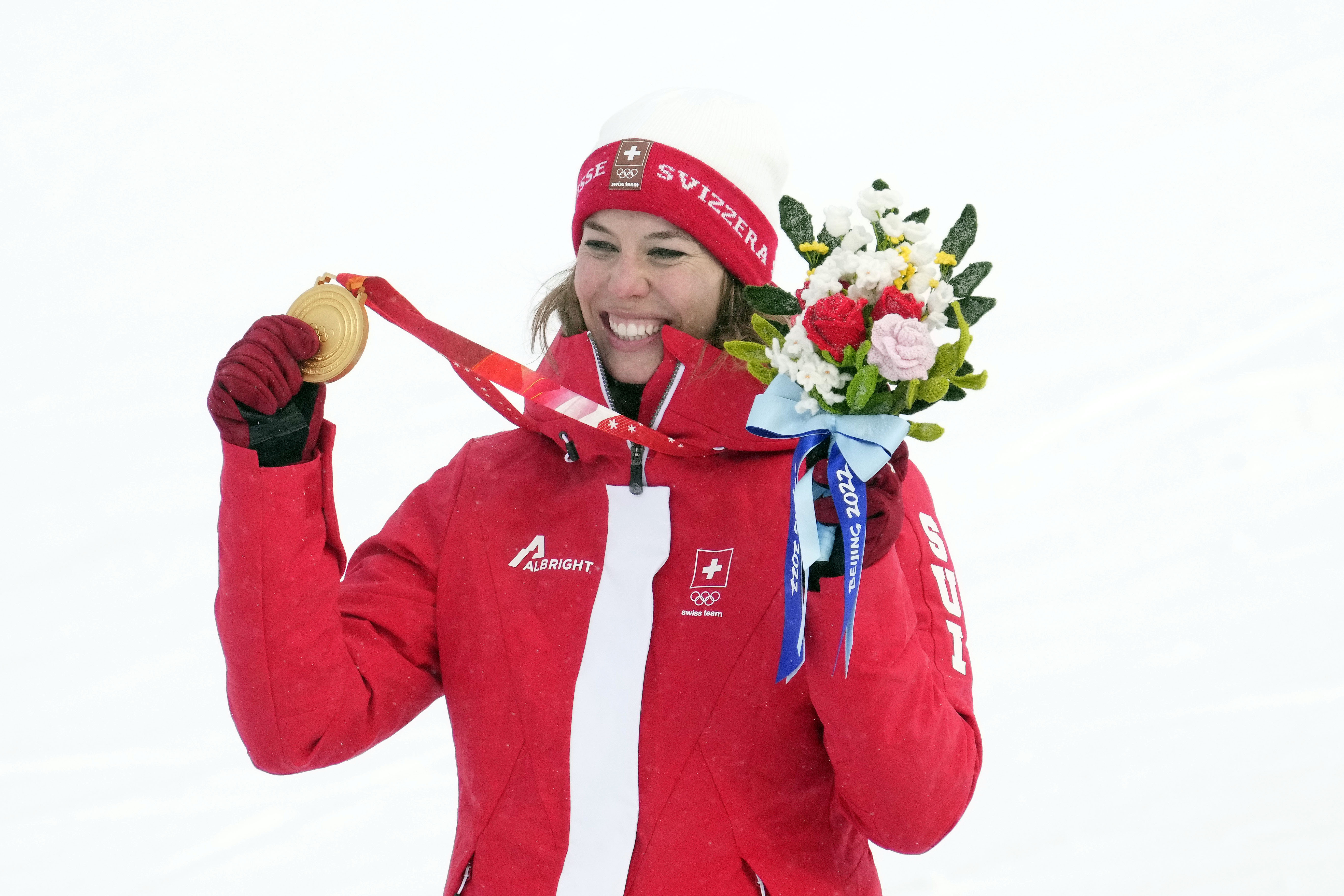 Michelle Gisin (SUI) celebrates after winning the gold medal in the women’s alpine skiing combined event during the Beijing 2022 Olympic Winter Games 