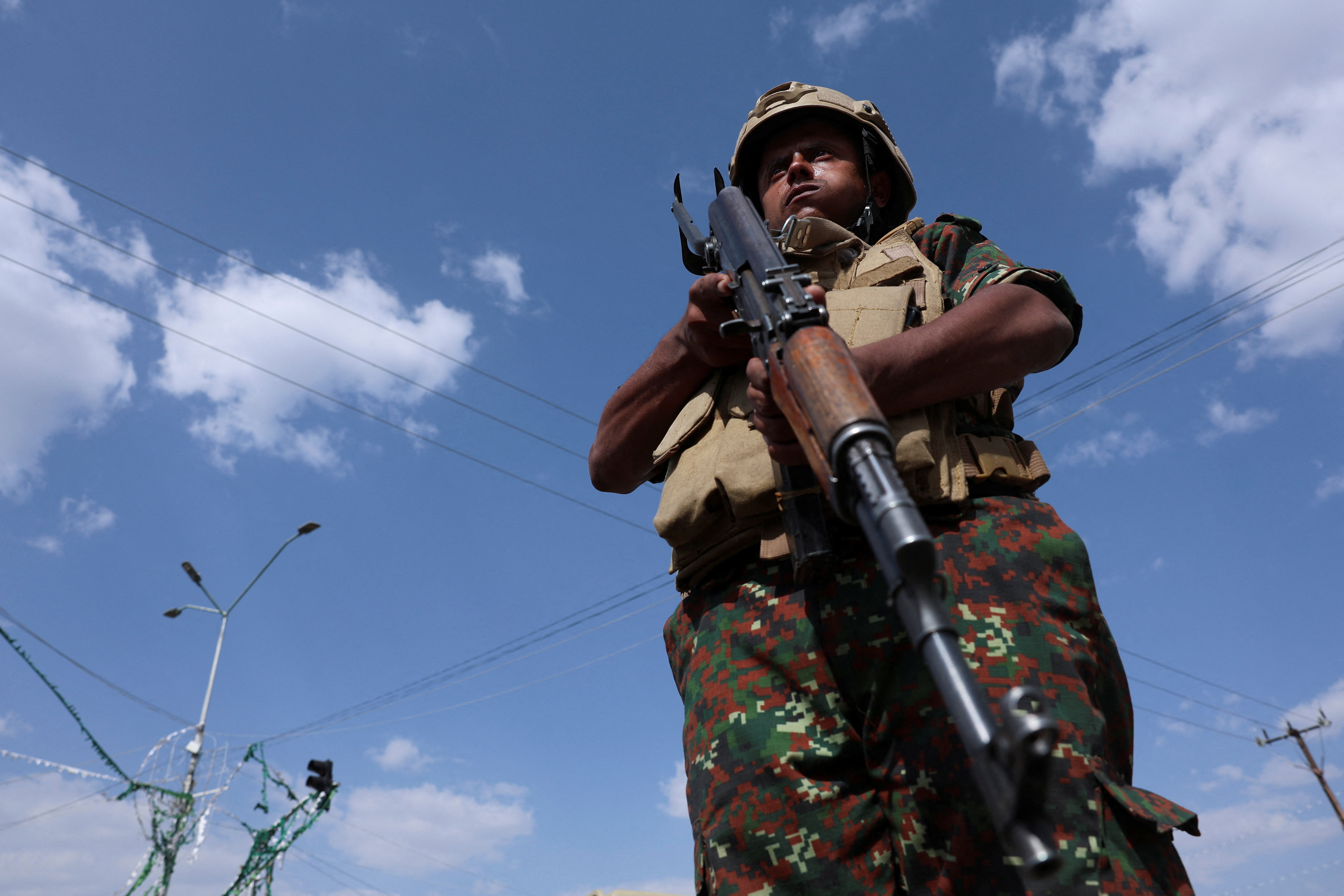 A member of Houthi security forces stands guard.
