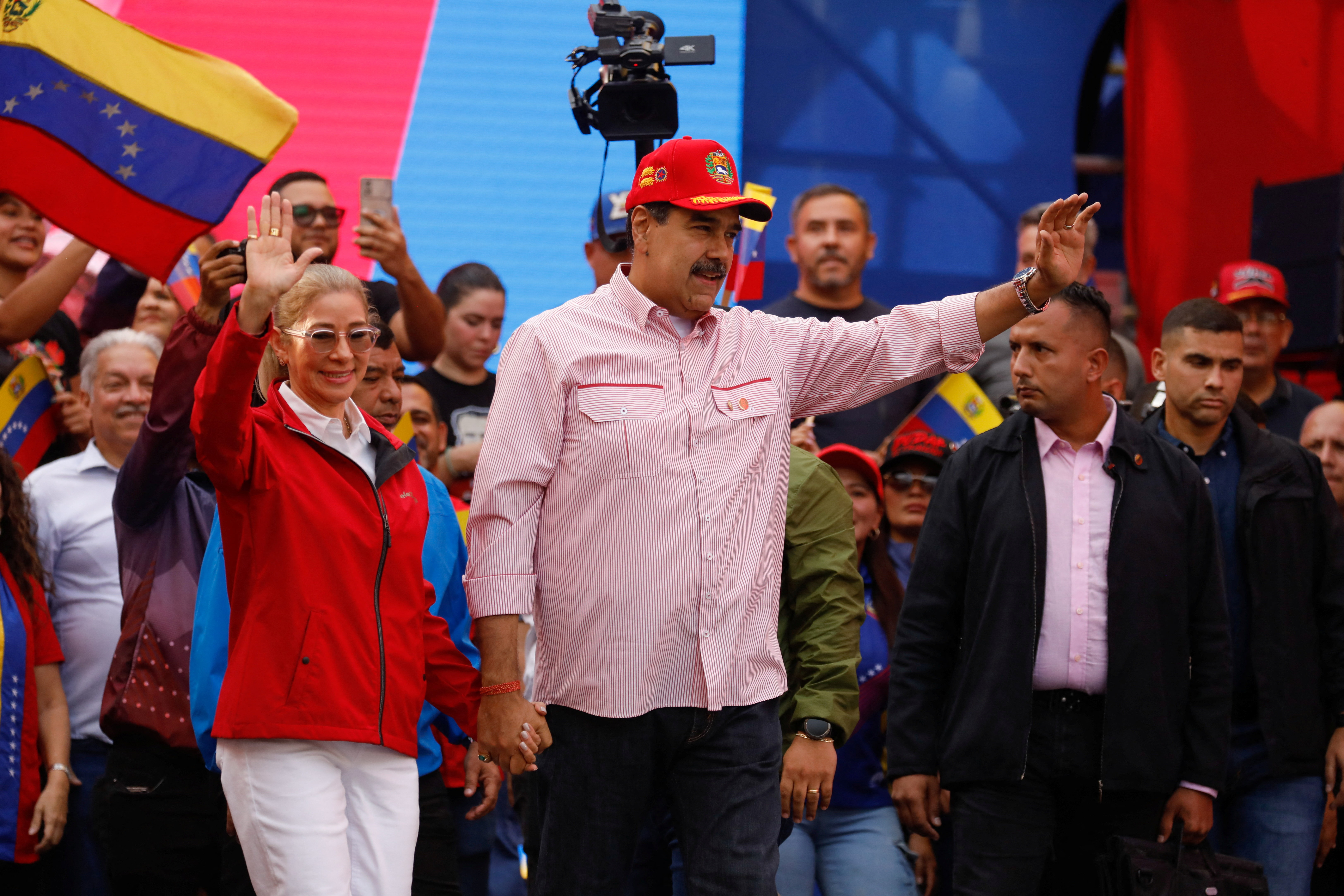 Venezuela’s President Nicolas Maduro with his wife Cilia Flores during a ceremony to swear in new community-based organisations in Caracas, Venezuela, on December 1, 2025