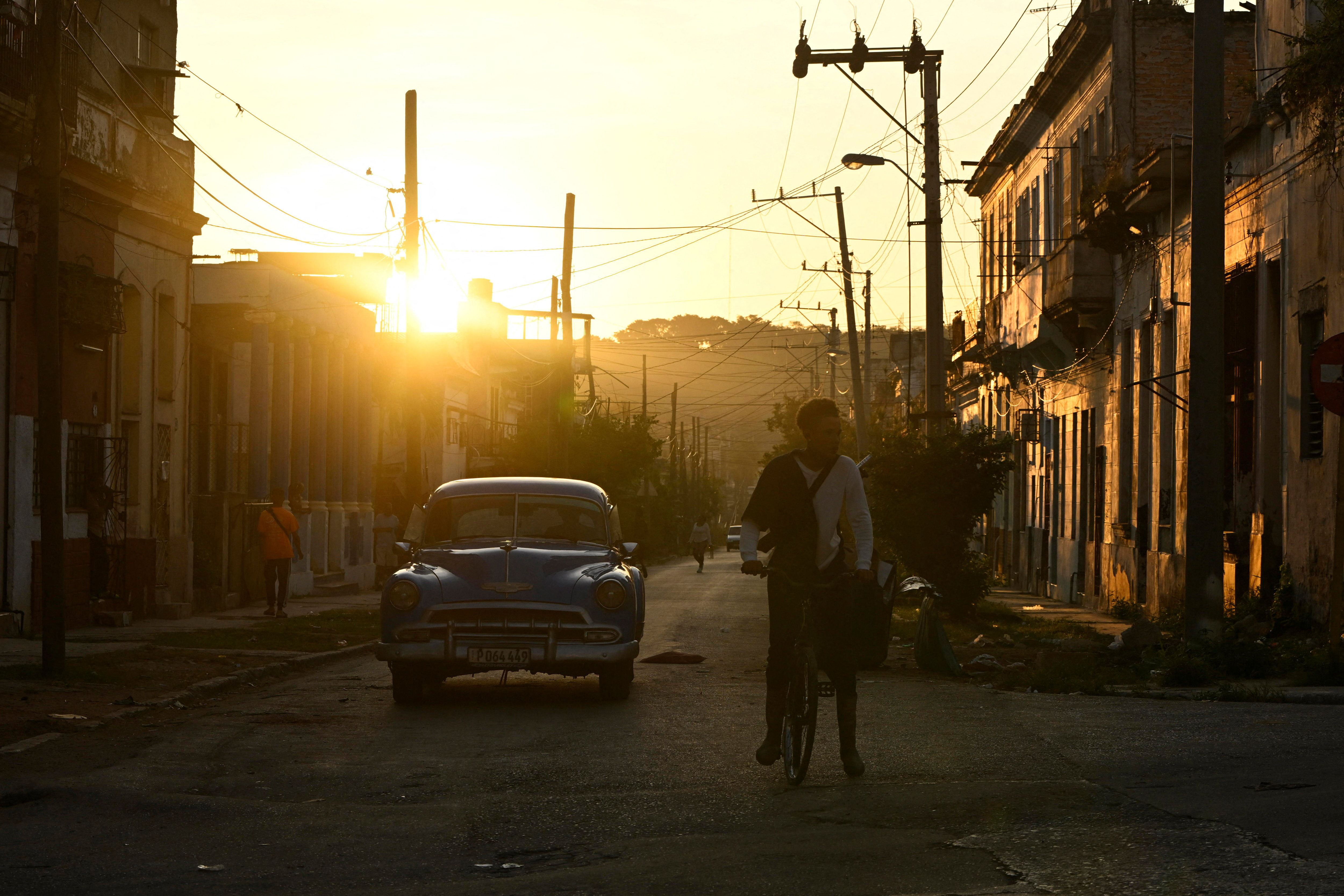 A vintage car is stopped at an intersection amid a partial collapse of the electrical grid, in Havana, Cuba