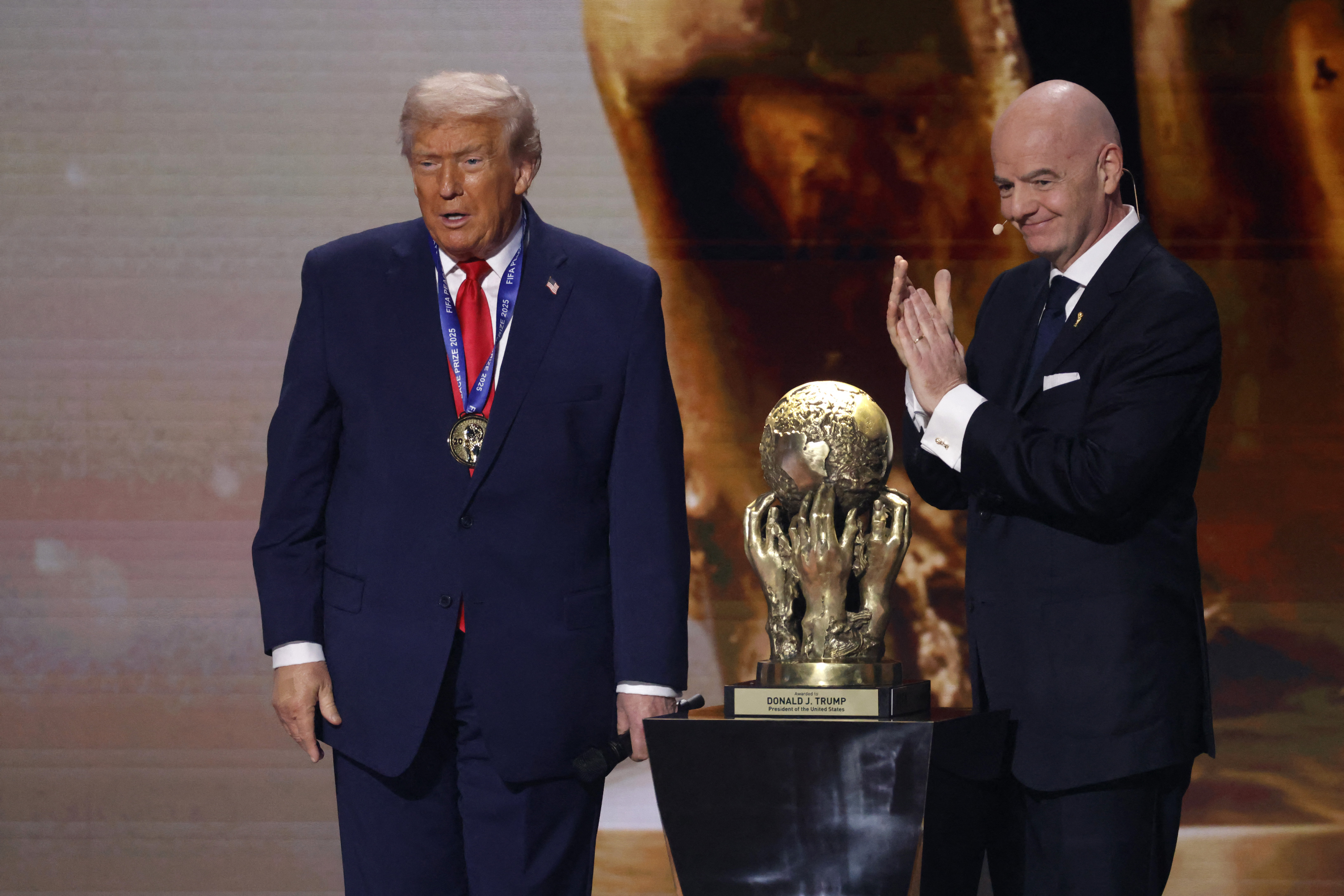 Gianni Infantini awards Trump a gold trophy