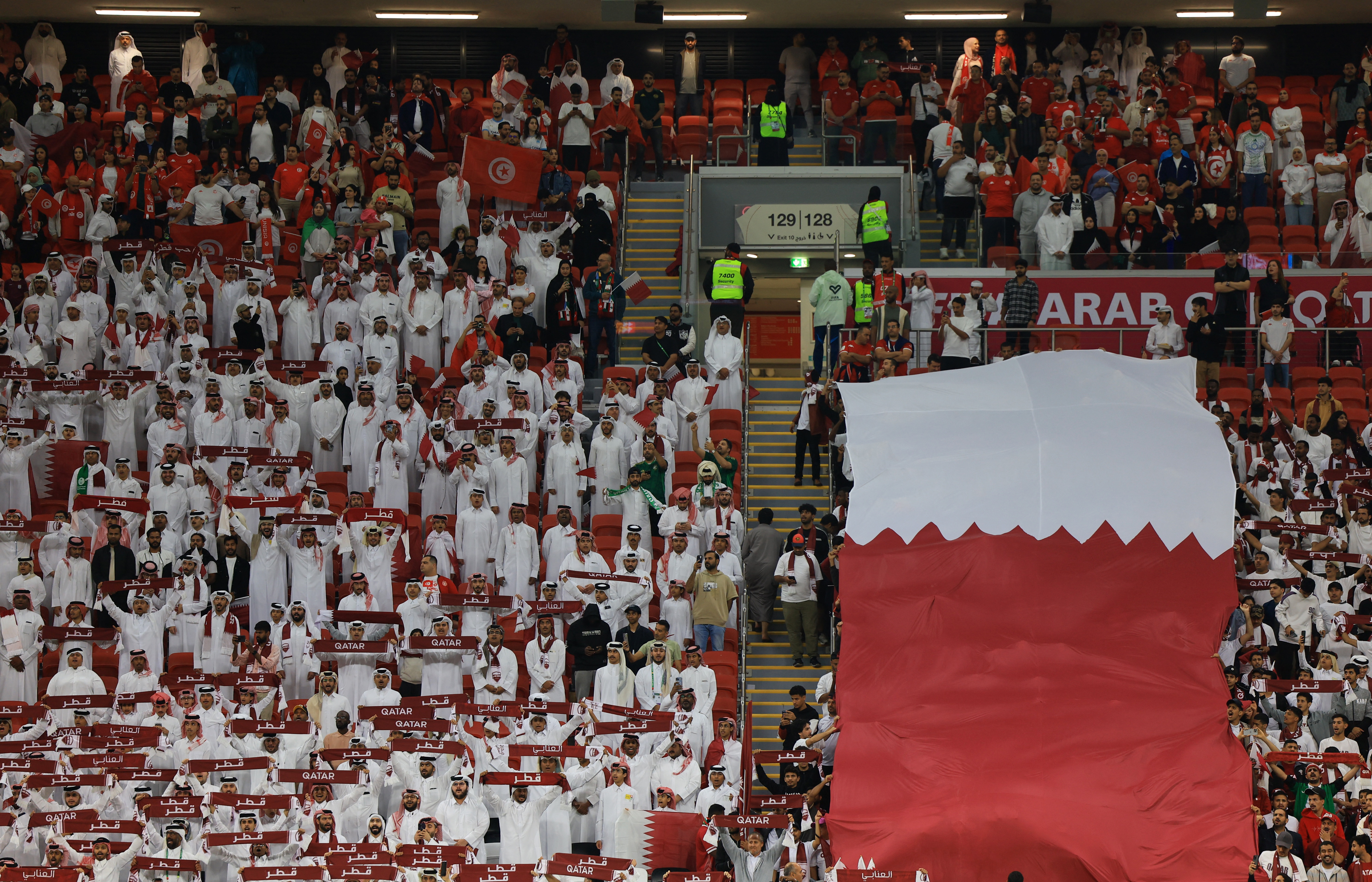 Soccer Football - FIFA Arab Cup - Qatar 2025 - Group A - Qatar v Tunisia - Al Bayt Stadium, Al Khor, Qatar - December 7, 2025 Qatar fans with a giant banner inside the stadium before the match REUTERS/Thaier Al-Sudani