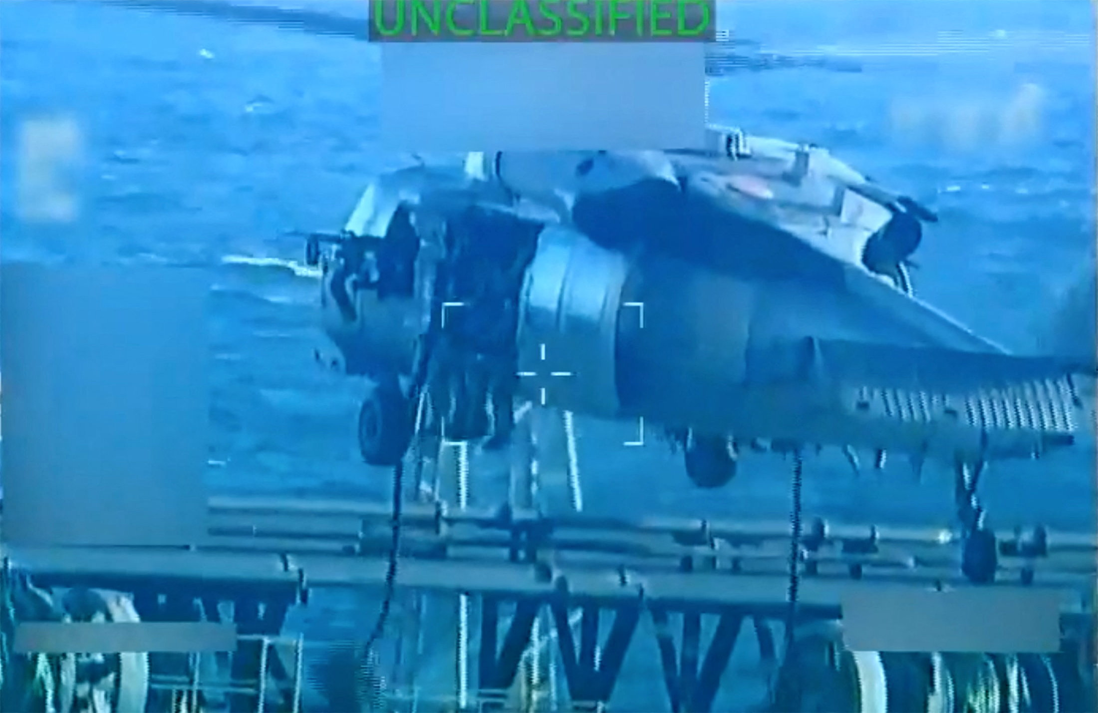 US forces abseil onto an oil tanker during a raid described by US Attorney General Pam Bondi as its seizure by the United States