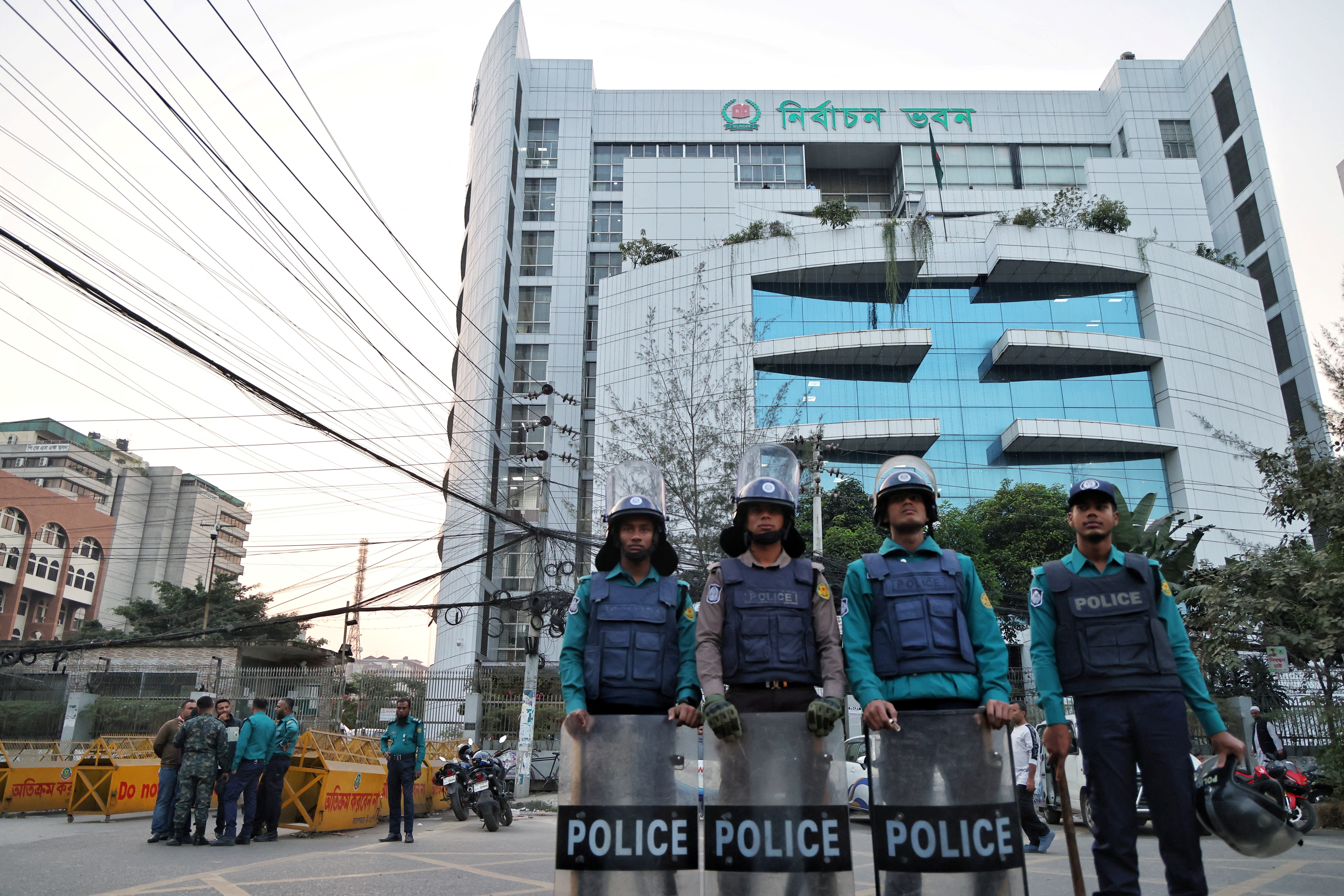 Policemen stand guard in front of the Bangladesh Election Commission