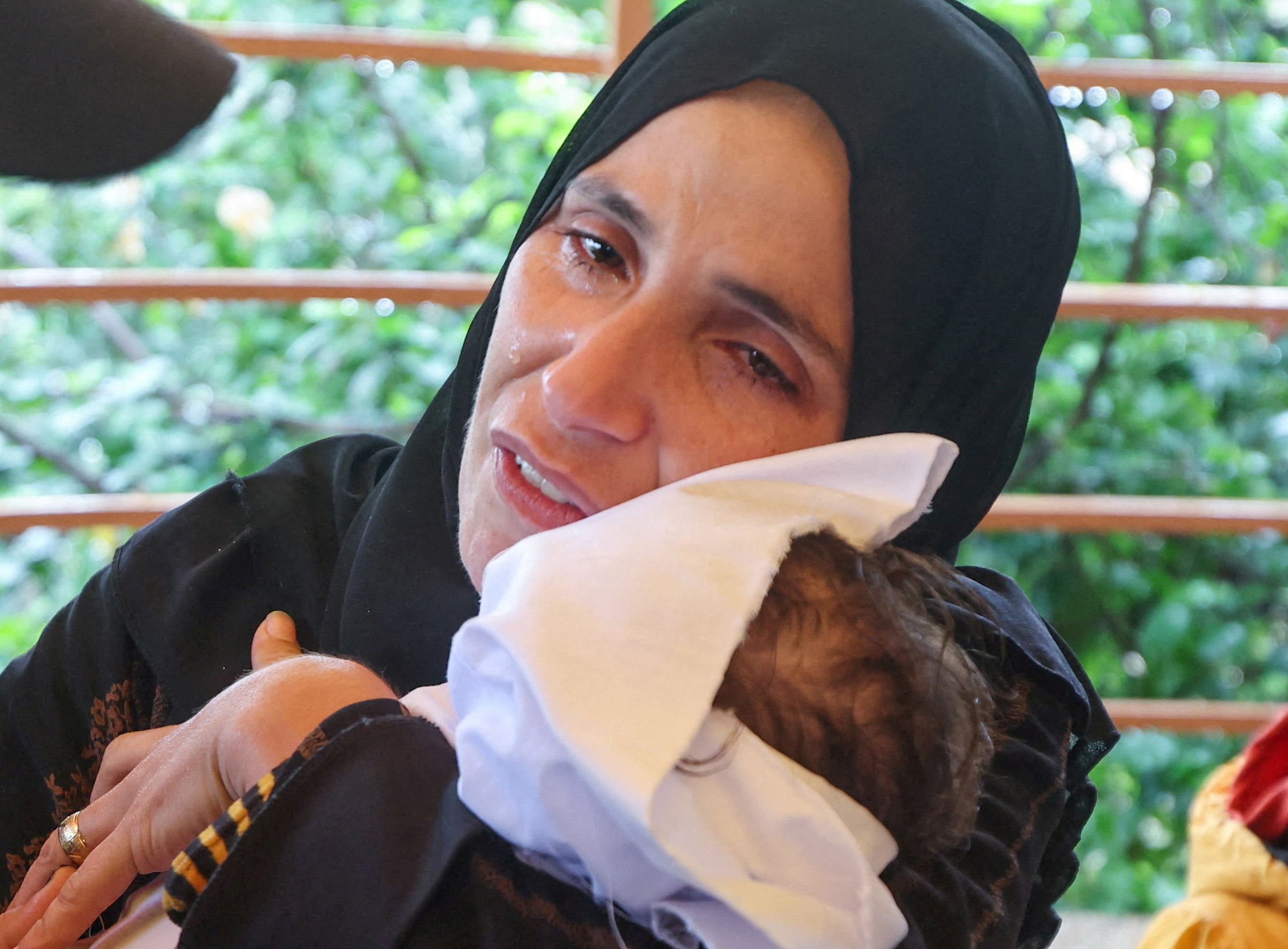 A Palestinian mother mourns her baby daughter Rahaf Abu Jazar, who died of cold in a tent