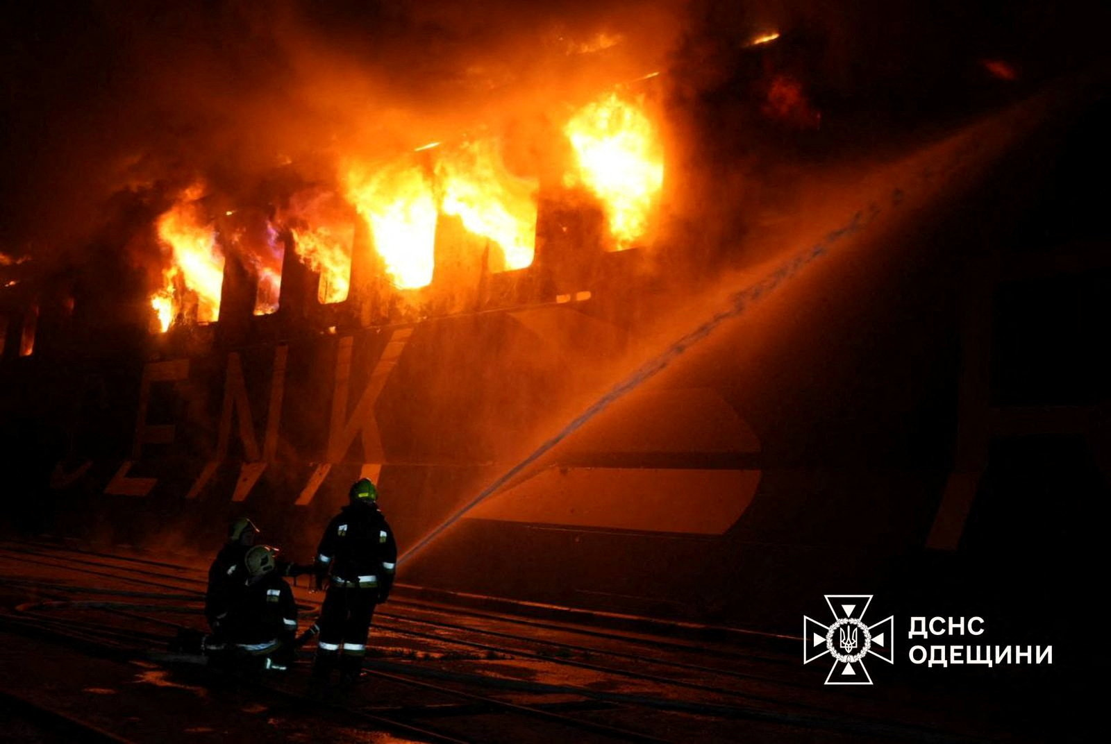 Firefighters work at the site of a civilian vessel hit during a Russian missile strike, amid Russia's attack on Ukraine, in the town of Chornomorsk, Odesa region, Ukraine, in this handout picture released December 12, 2025. Press service of the State Emergency Service of Ukraine in Poltava region/Handout via REUTERS ATTENTION EDITORS - THIS IMAGE HAS BEEN SUPPLIED BY A THIRD PARTY. WATERMARK FROM SOURCE. MANDATORY CREDIT.