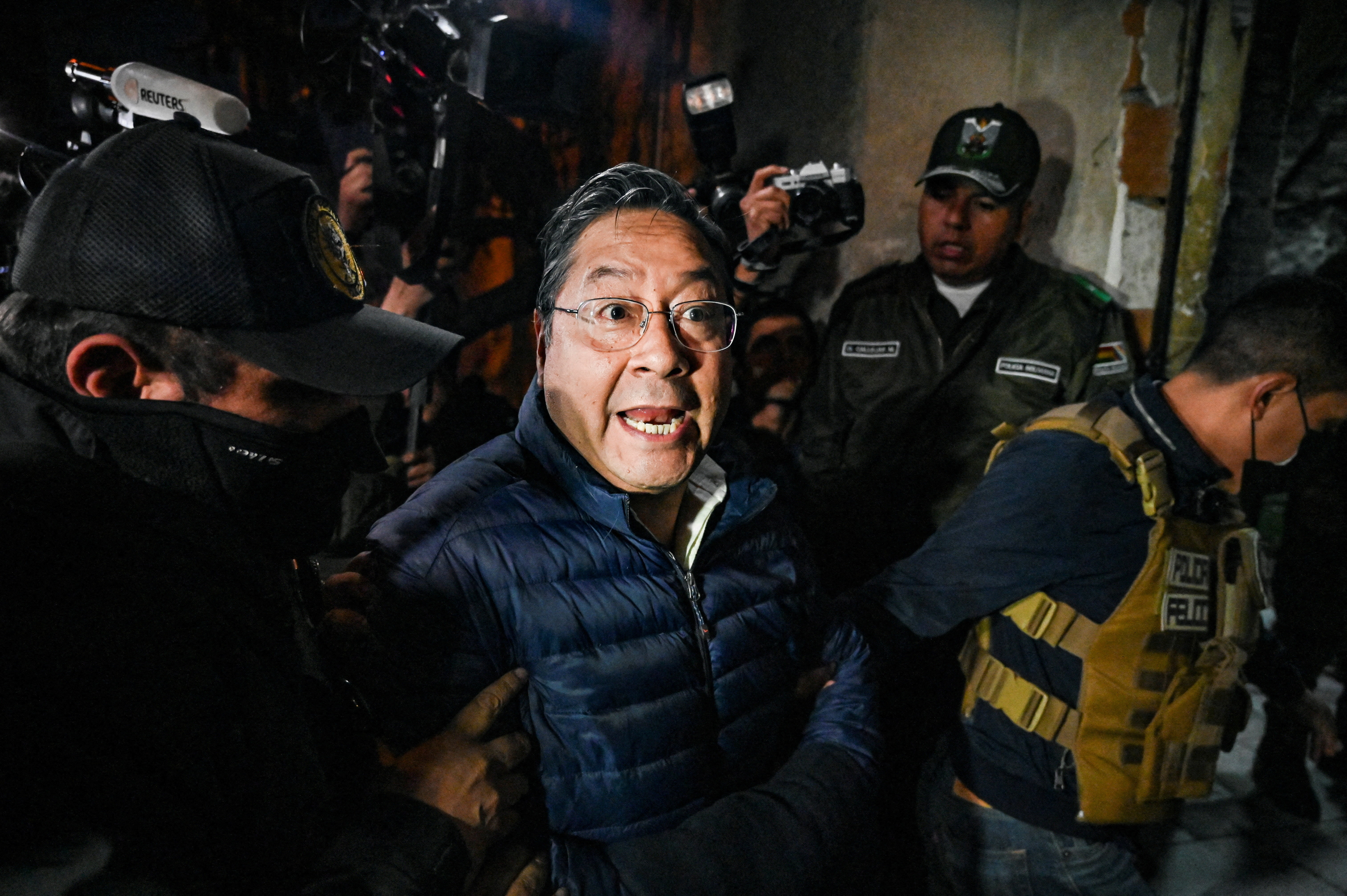 Former Bolivian President Luis Arce Catacora enters San Pedro prison after a judge ordered him held in pre-trial detention for five months as part of an investigation into alleged embezzlement, in La Paz, Bolivia, December 12, 2025. REUTERS/Claudia Morales TPX IMAGES OF THE DAY