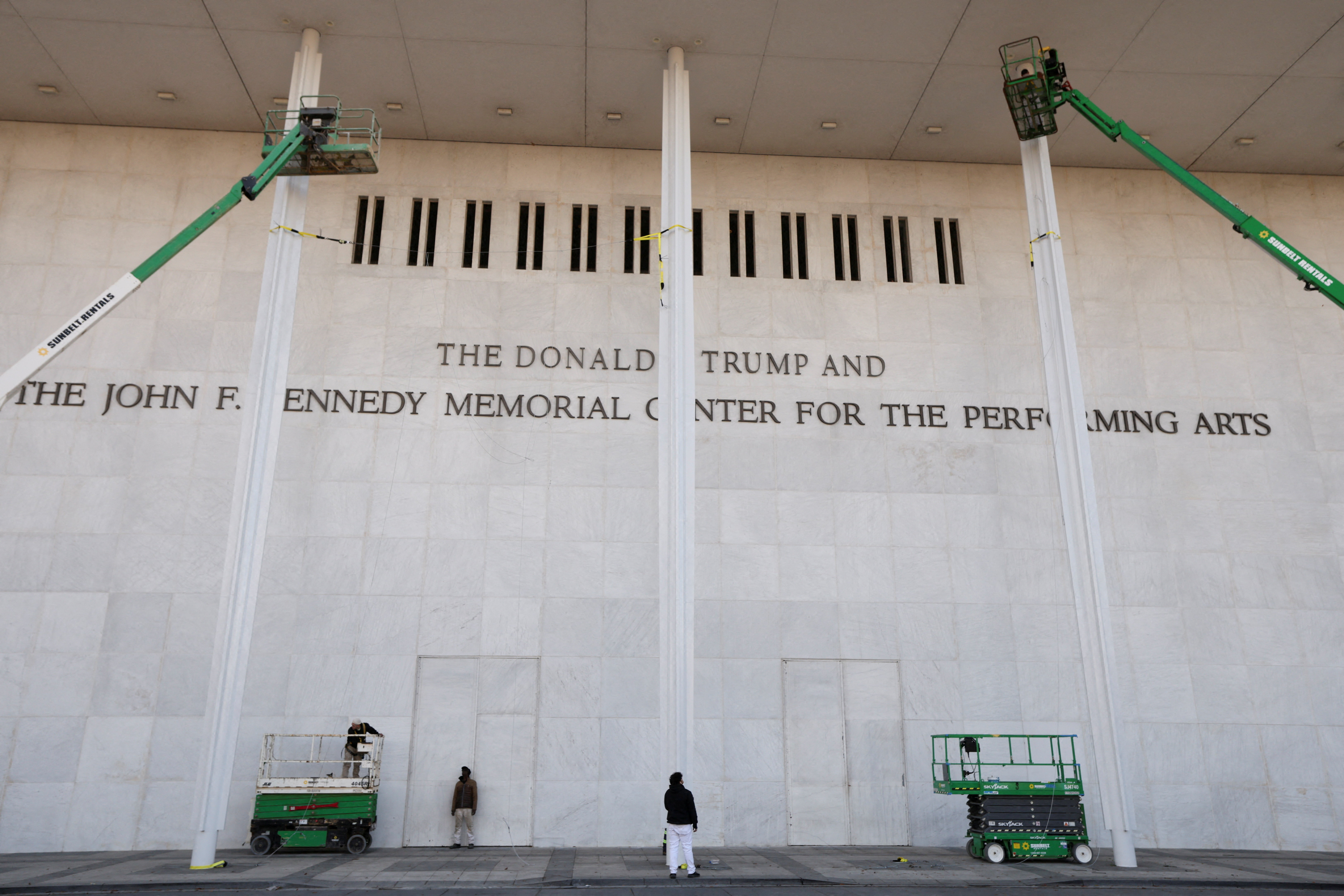 The newly added lettering for U.S. President Donald Trump's name is displayed at the facade of the John F. Kennedy Center for the Performing Arts, a day after its board announced it would rename the institution The Donald J. Trump and The John F. Kennedy Memorial Center for the Performing Arts, in Washington, D.C., U.S., December 19, 2025. REUTERS/Kevin Lamarque TPX IMAGES OF THE DAY