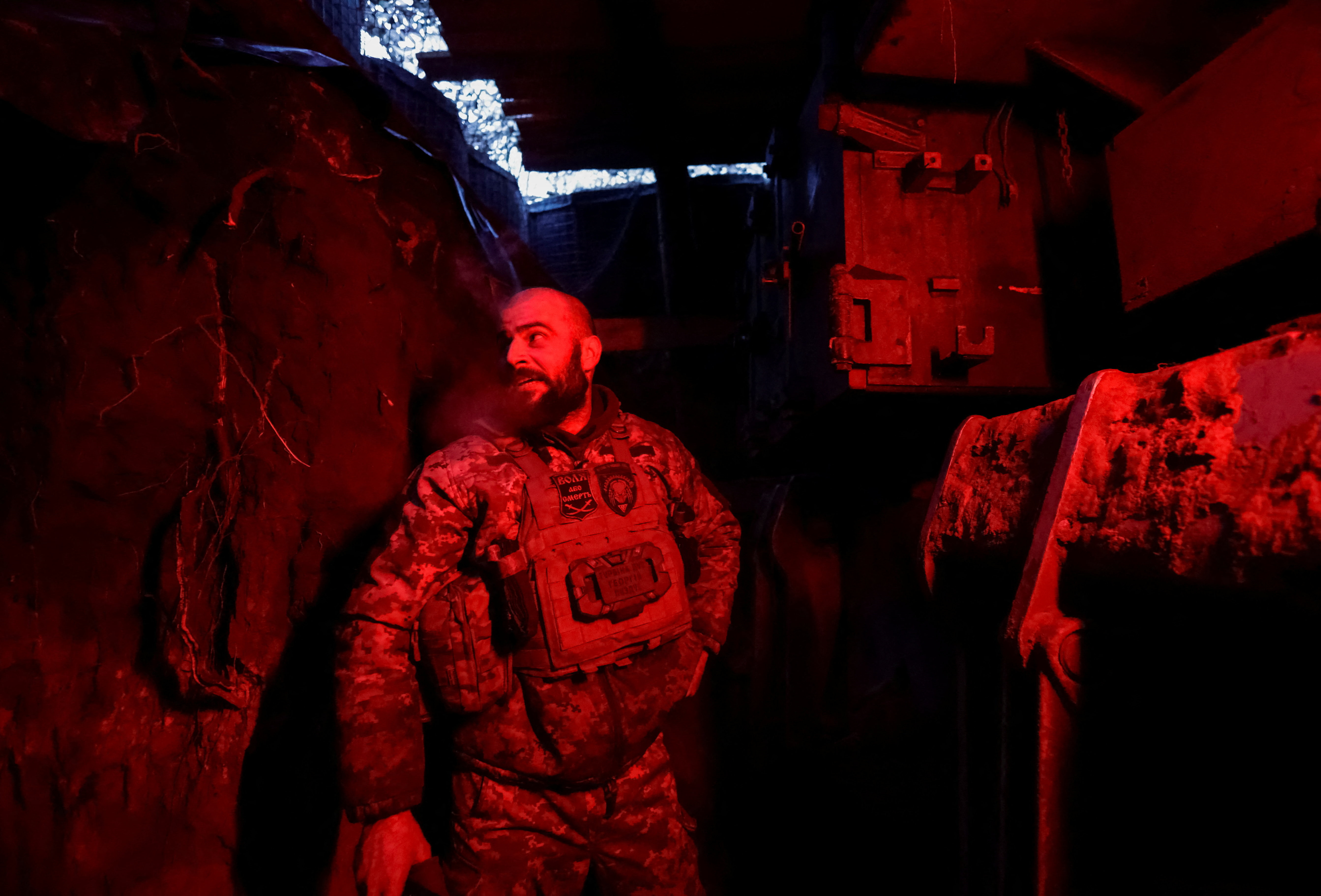 A Ukrainian serviceman fires artillery towards Russian forces