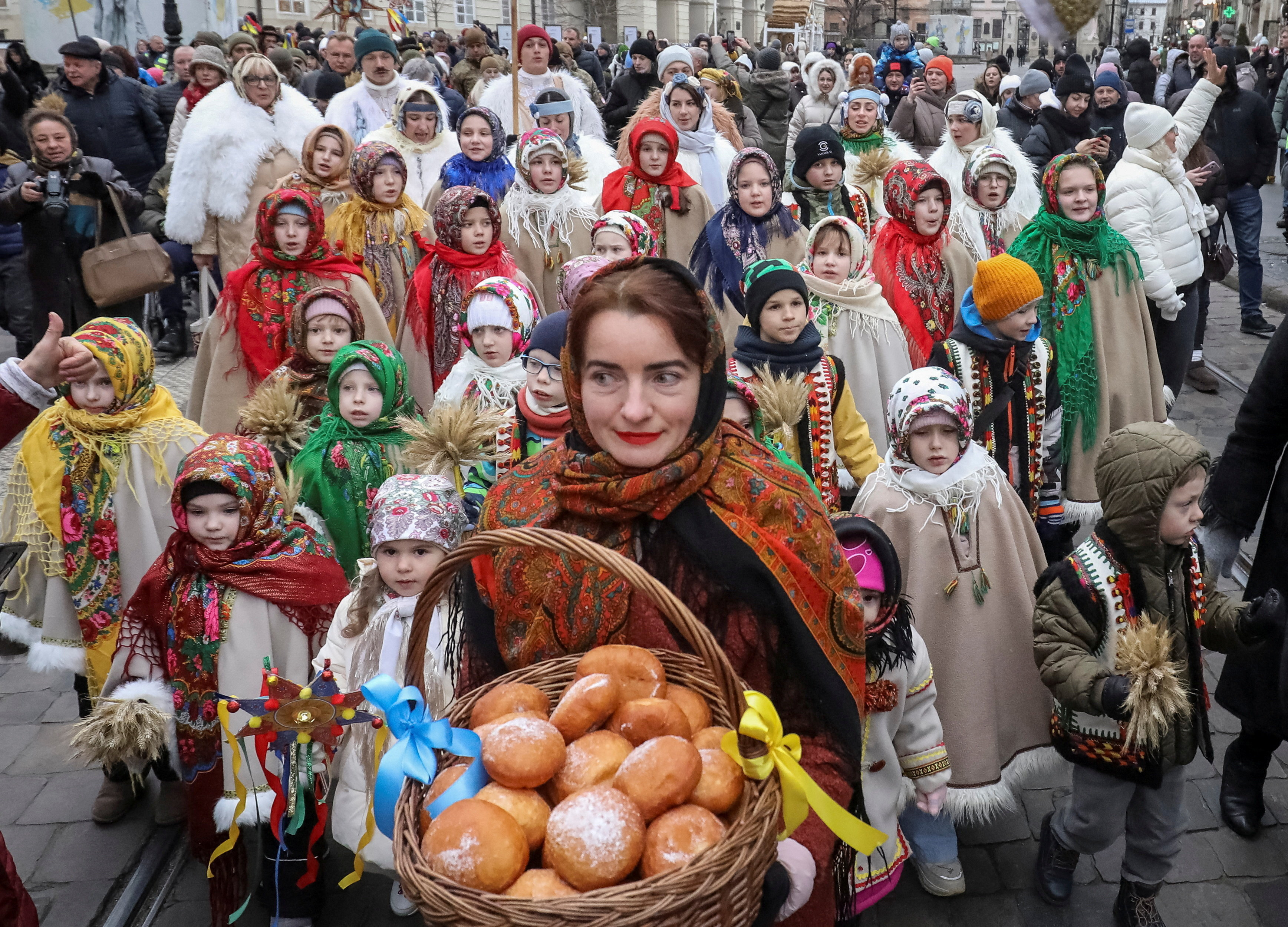People dressed in traditional Ukrainian costumes attend a Christmas celebration