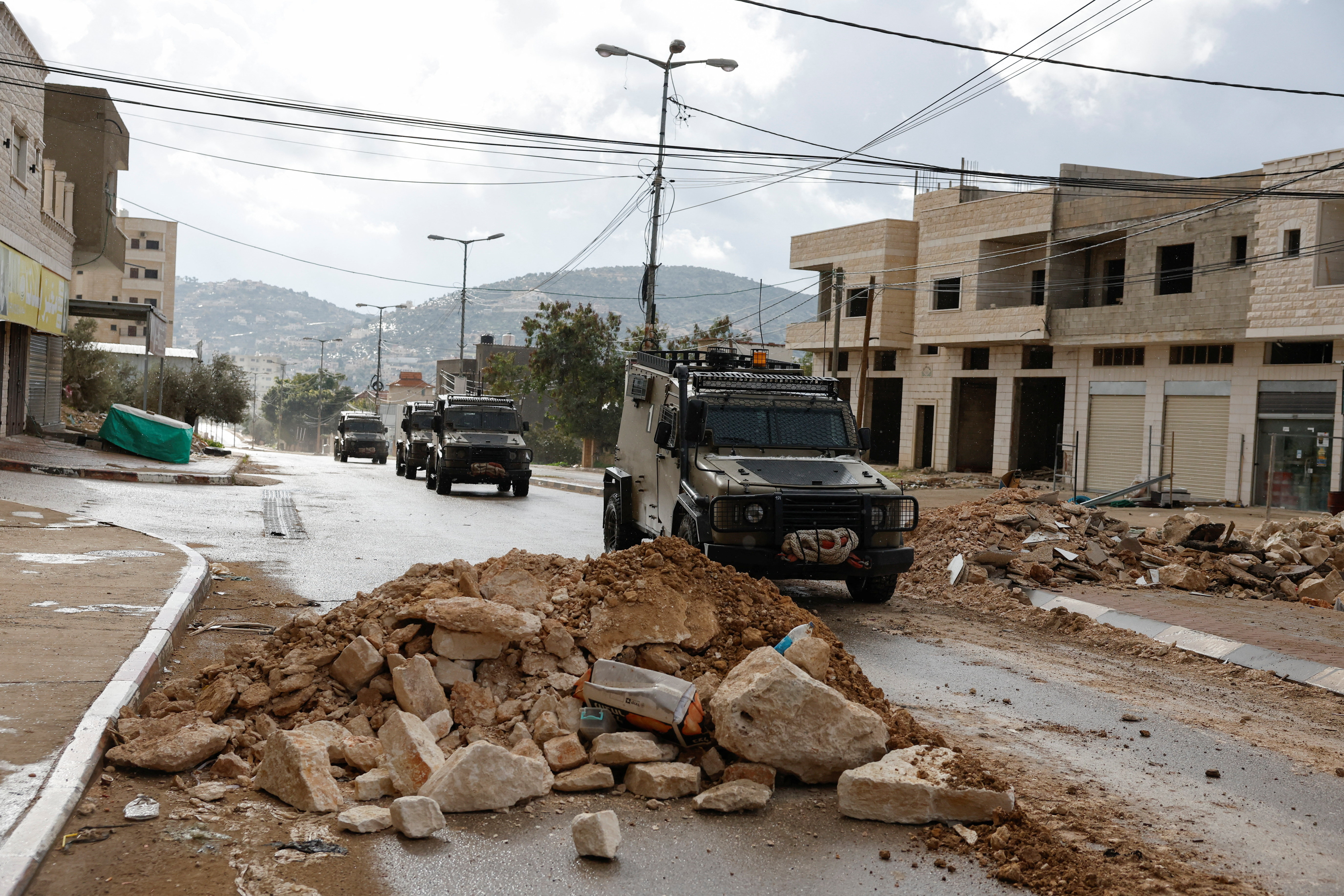 Military vehicles operate during an Israeli raid.