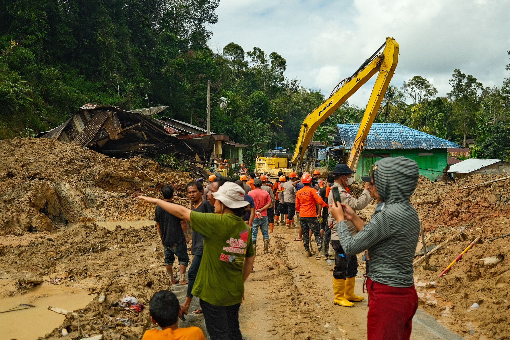 Many survivors are looking for their missing loved ones. Some were carried away by floodwaters, others buried under the mud.