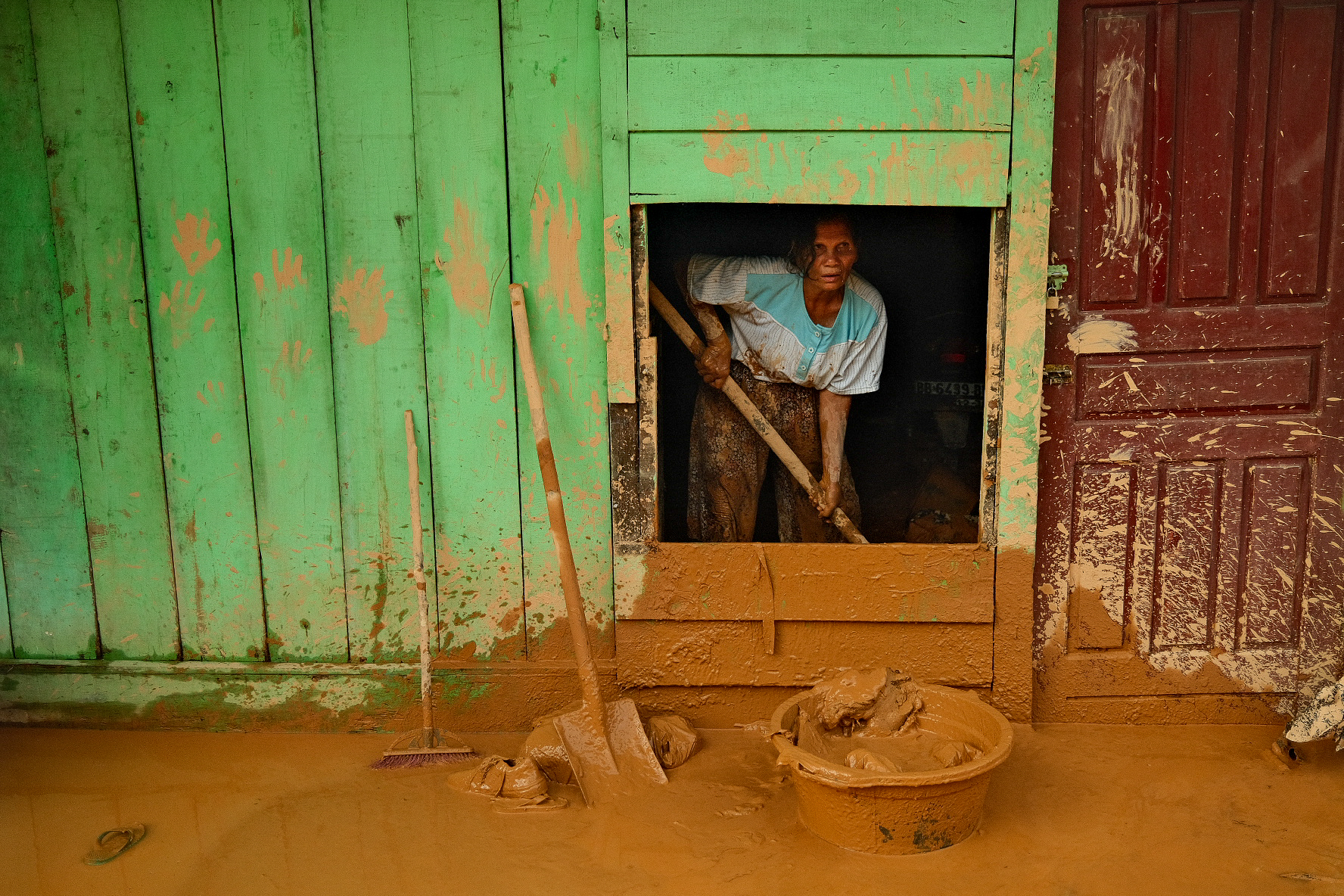 This woman said all the products in her small store had been ruined or washed away. “I’m cleaning up by myself, no one Is helping because everyone is very busy with their own problems,” she said.