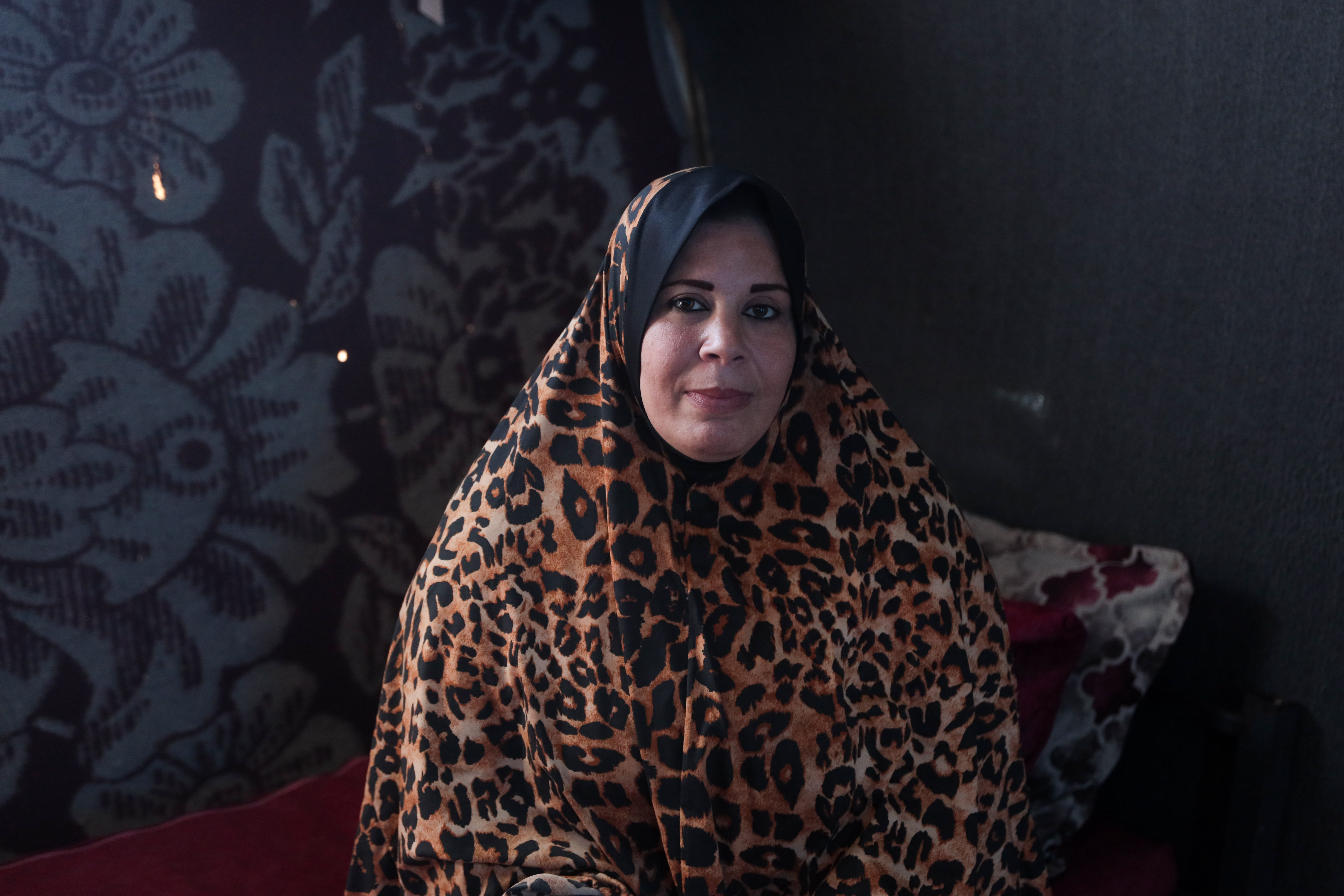 Sana’a Issa, 41, a widow who lost her husband during the war and mother of seven, is currently displaced in a camp in Deir al-Balah, in the central Gaza Strip, after fleeing from the Bureij camp [Abdelhakim Abu Riash/ Al Jazeera]