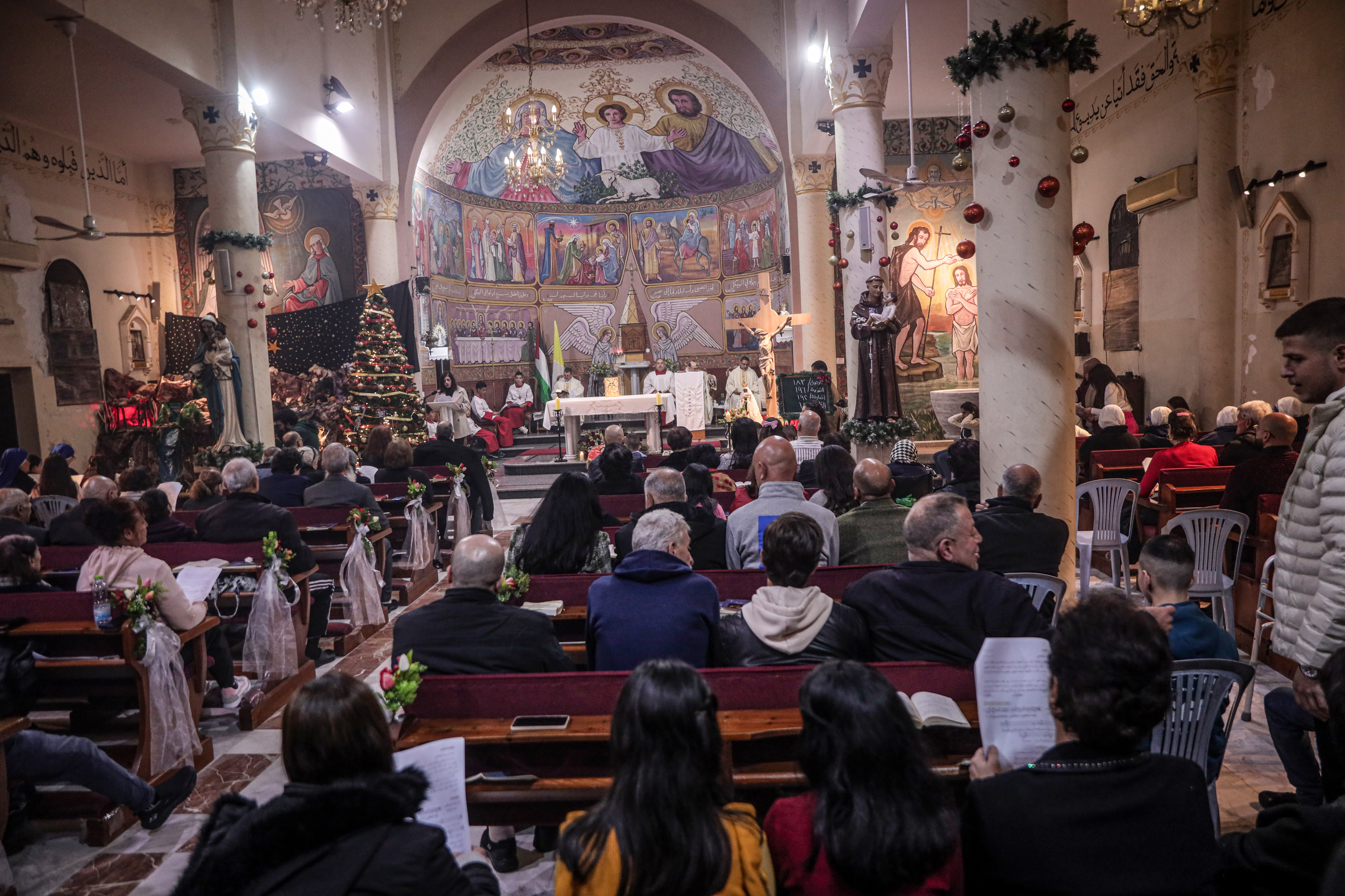 People attend prayers at a church.