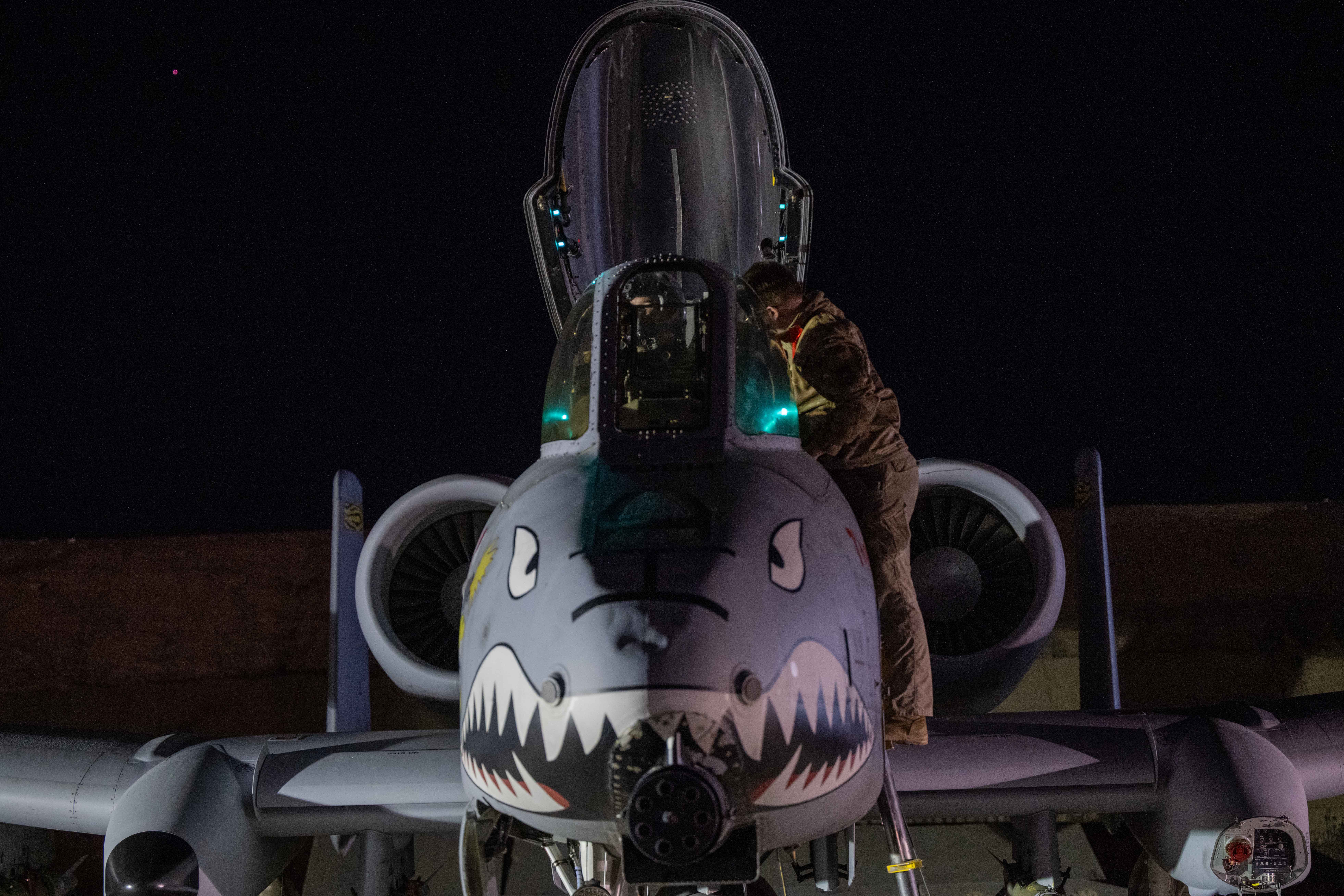 A U.S. Airman prepares an A-10 Thunderbolt II for flight from a base in the U.S. Central Command area of responsibility, Dec. 19, in support of Operation Hawkeye Strike. [U.S. Air Force]