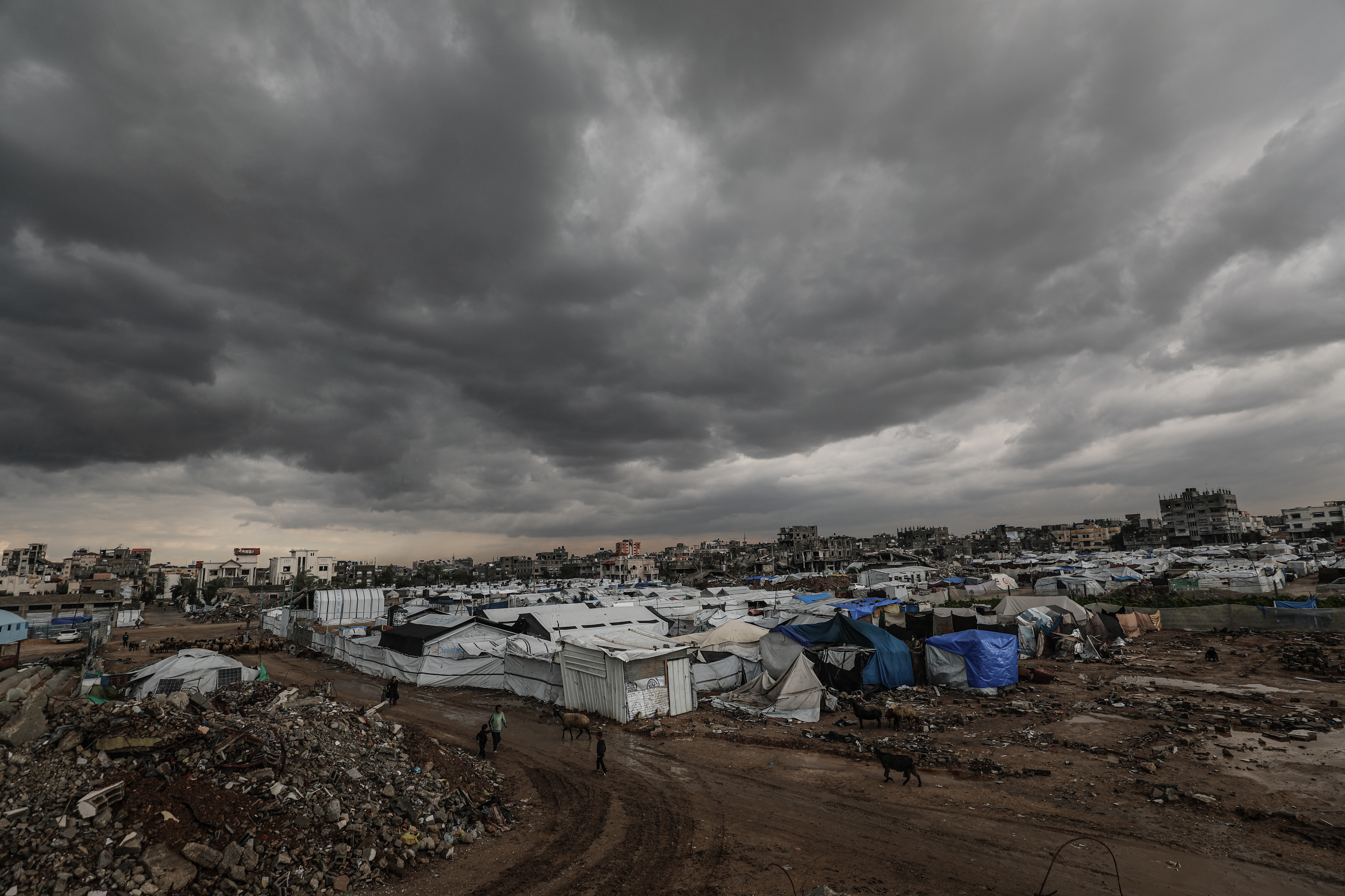 Flooding hits displaced Palestinians’ tents after heavy rain in Gaza