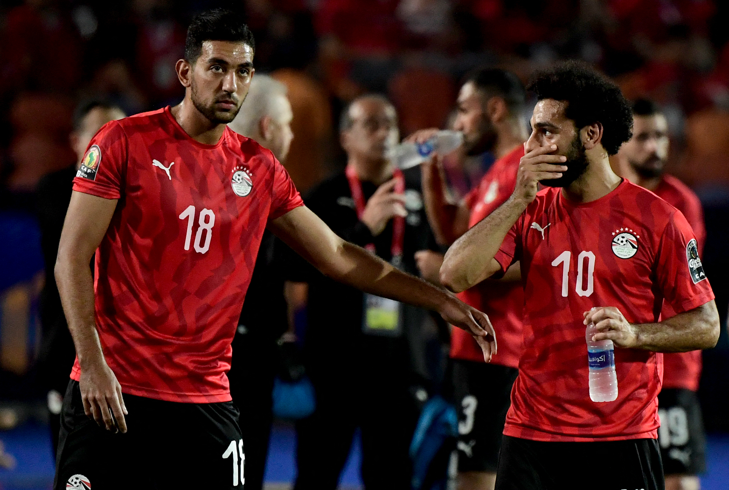 Egypt's forward Ahmed 'Kouka' Hassan and Mohamed Salah react.