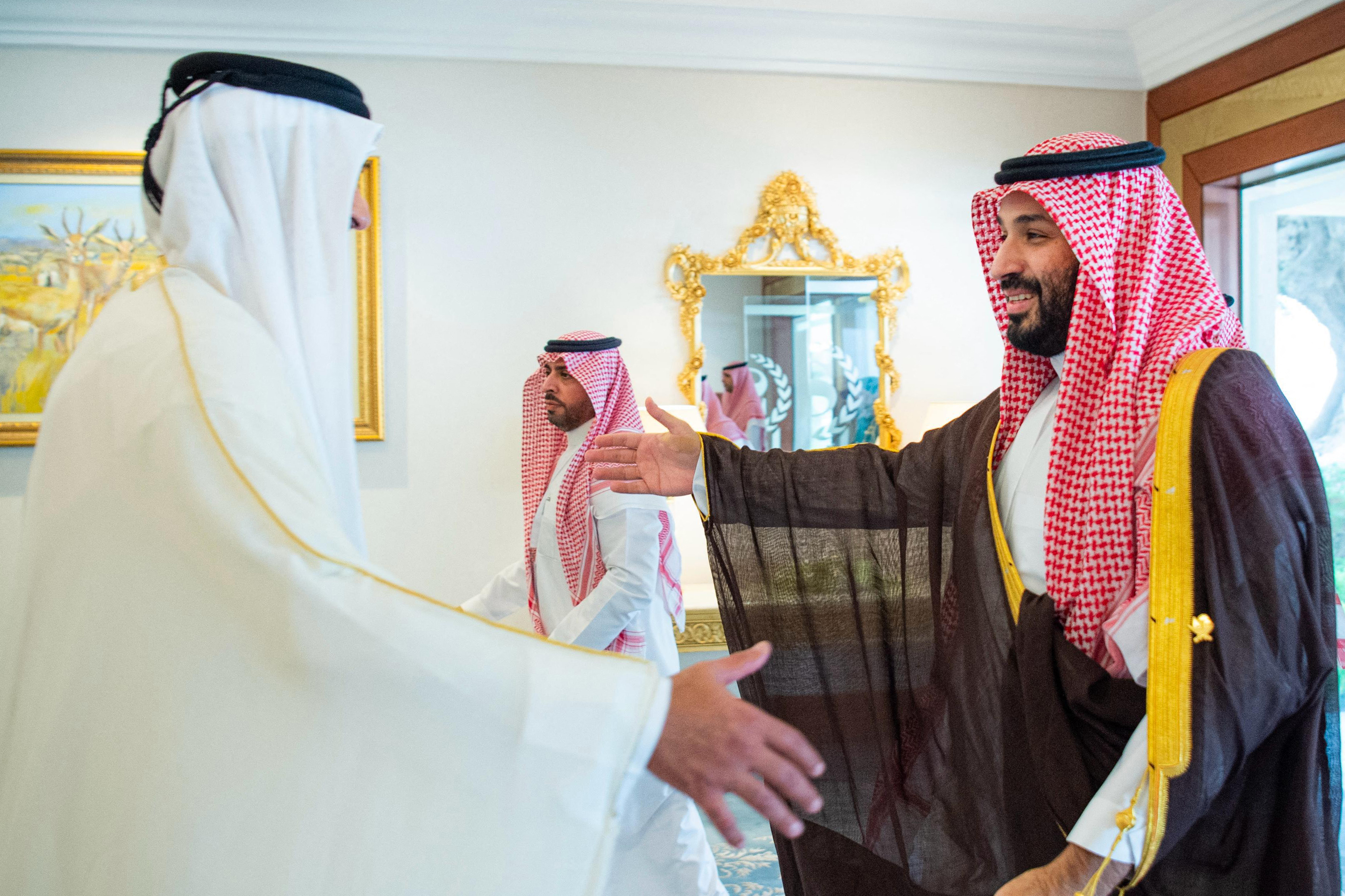 Qatar's Emir Tamim bin Hamad Al-Thani (L) receives Saudi Arabia's Crown Prince Mohammed bin Salman ahead of the 2025 Arab-Islamic Emergency Summit in Doha on September 15, 2025.