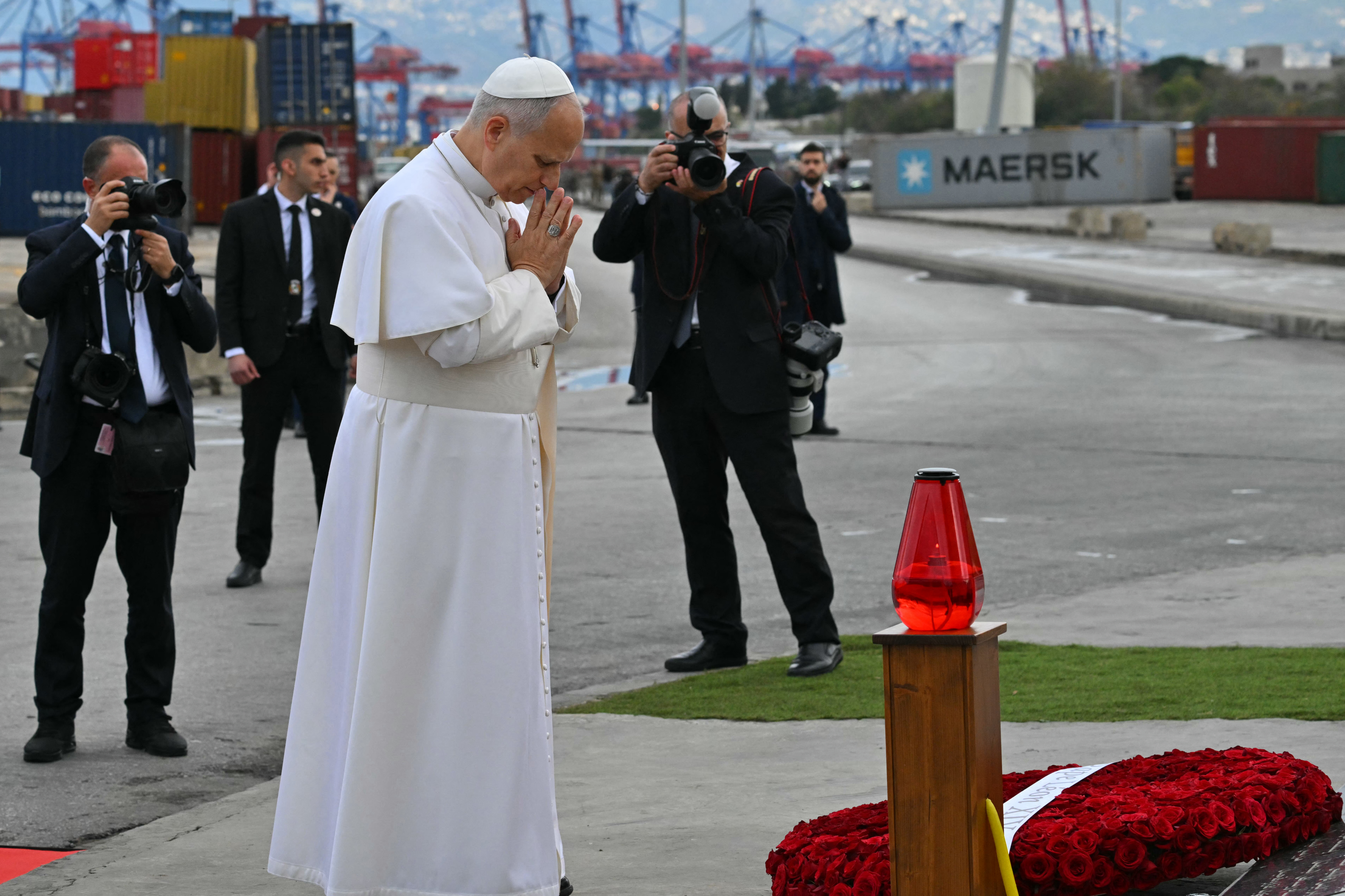 Pope Leo XIV prays at the site of the 2020 Beirut port explosion.