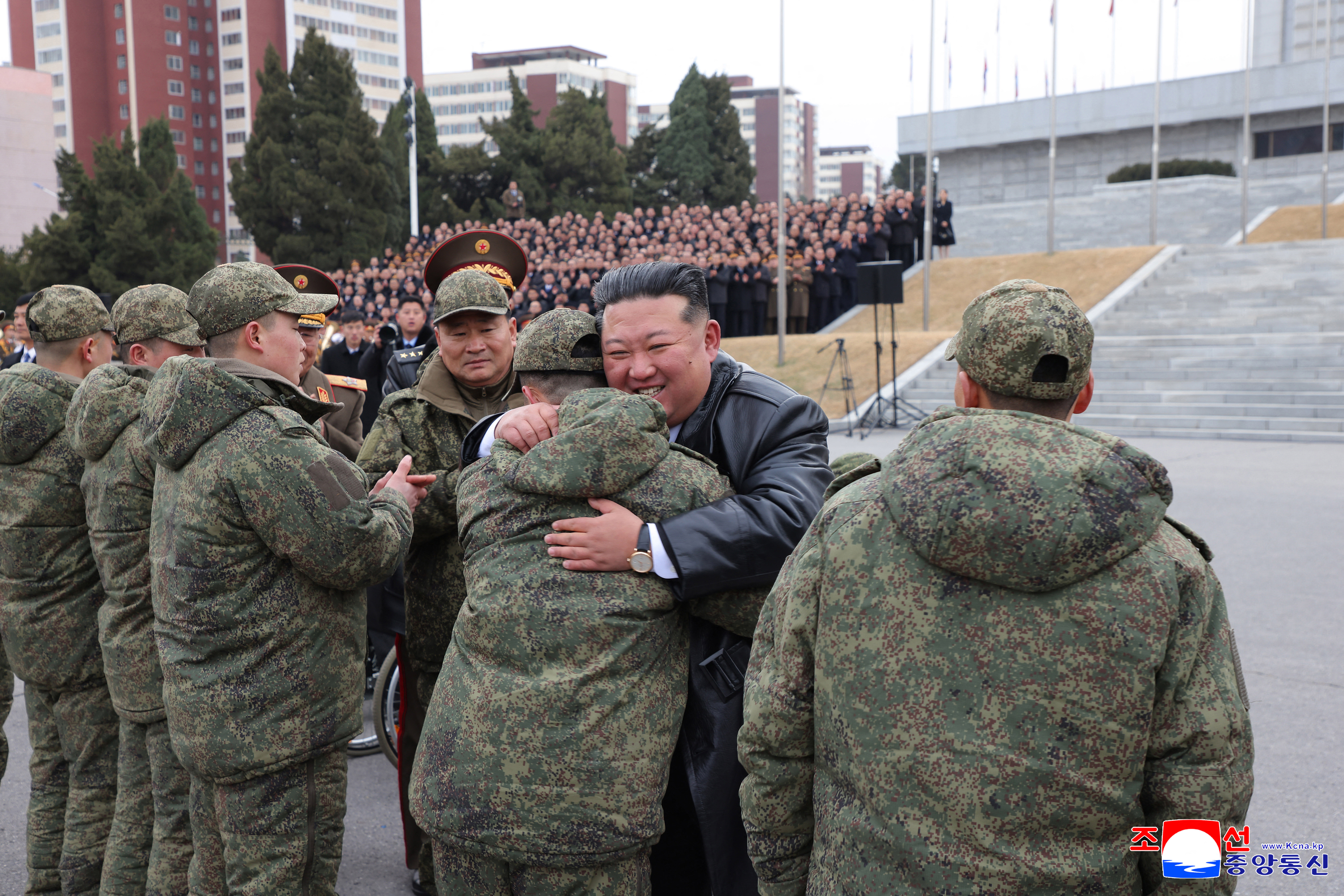 This picture taken on December 12, 2025 and released from North Korea's official Korean Central News Agency (KCNA) on December 13 shows North Korean leader Kim Jong Un welcoming soldiers from the Korean People's Army's 528th Regiment of Engineers, which returned from an overseas deployment in Russia's Kursk region during Moscow's war with Ukraine, in front of the April 25 House of Culture in Pyongyang. (Photo by KCNA VIA KNS / AFP) / South Korea OUT / SOUTH KOREA OUT / SOUTH KOREA OUT / ---EDITORS NOTE--- RESTRICTED TO EDITORIAL USE - MANDATORY CREDIT "AFP PHOTO/KCNA VIA KNS" - NO MARKETING NO ADVERTISING CAMPAIGNS - DISTRIBUTED AS A SERVICE TO CLIENTS / THIS PICTURE WAS MADE AVAILABLE BY A THIRD PARTY. AFP CAN NOT INDEPENDENTLY VERIFY THE AUTHENTICITY, LOCATION, DATE AND CONTENT OF THIS IMAGE --- /