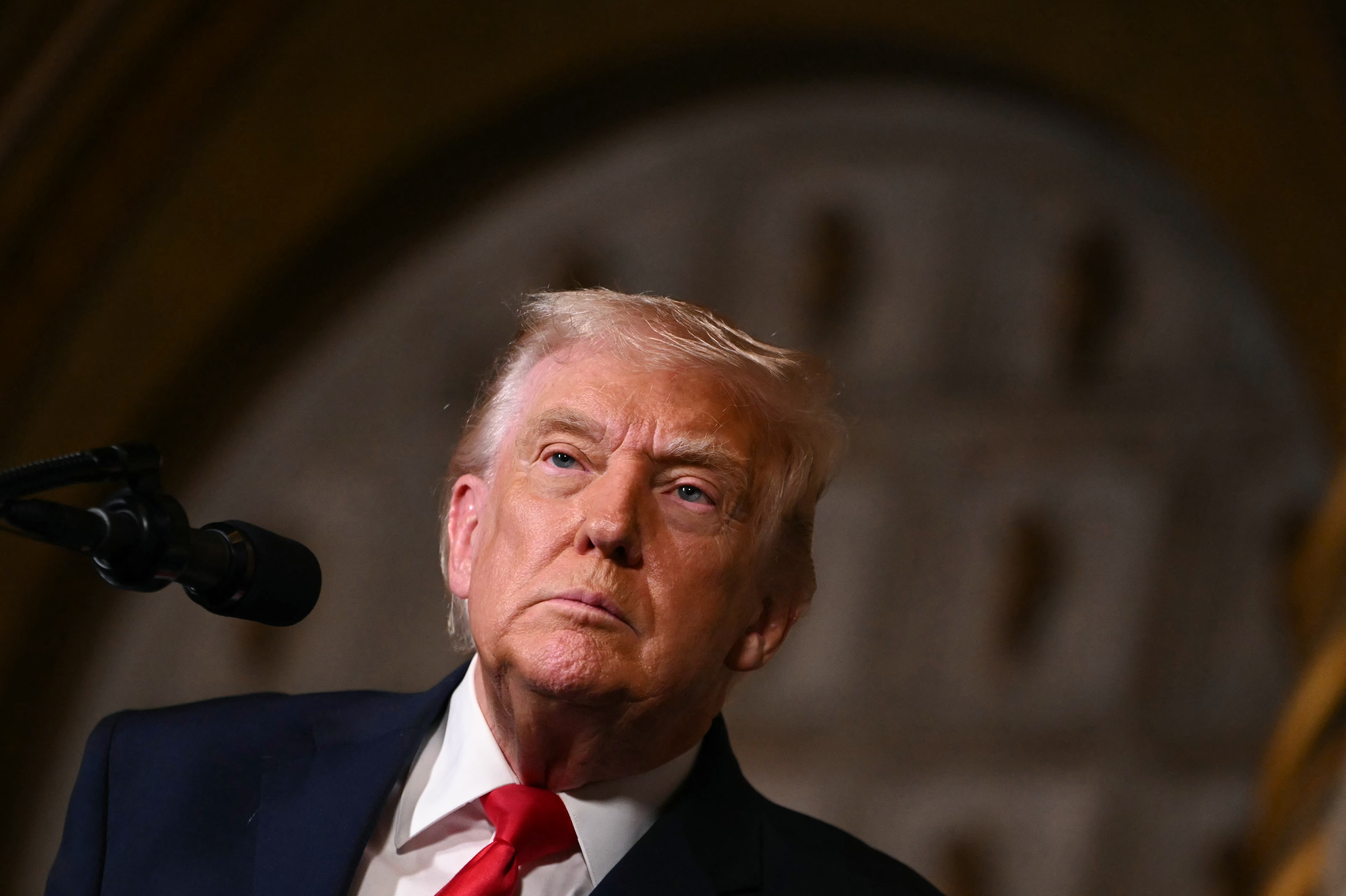 US President Donald Trump takes questions from journalists after announcing the US Navys new Golden Fleet initiative, unveiling a new class of warships, at Mar-a-Lago in Palm Beach, Florida, on December 22, 2025. President Donald Trump on December 22 announced a new class of heavily armed warships that will be named after himself -- an honor usually reserved for US leaders who have left office. Two of the Trump-class ships will be built initially but that number could grow substantially in the future, according to the president, who said they will be "some of the most lethal surface warfare ships" and "the largest battleship in the history of our country." Trump made the announcement at his Mar-a-Lago residence in Florida alongside Pentagon chief Pete Hegseth, Secretary of State Marco Rubio and Navy Secretary John Phelan, with images of the planned high-tech vessels on stands nearby. (Photo by ANDREW CABALLERO-REYNOLDS / AFP)