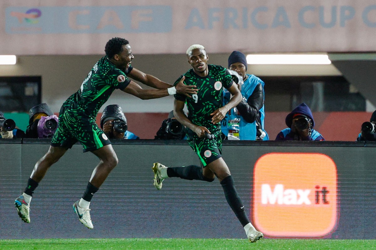 Nigeria's forward #09 Victor Osimhen (R) celebrates his goal with Nigeria's defender #02 Bright Osayi-Samuel during the Africa Cup of Nations