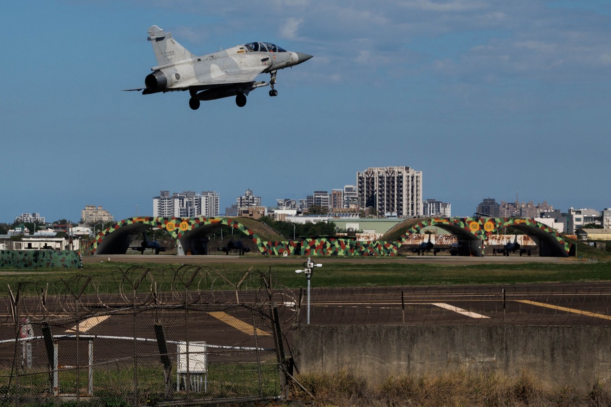A Taiwan Air Force Mirage 2000 fighter jet takes off at Hsinchu Air Base in Hsinchu on December 29, 2025. China launched "major" military exercises around Taiwan on December 29, in what it called a "stern warning" involving live-fire drills in waters and airspace near the island. Taiwan said Monday it had detected four Chinese coastguard ships near the island's waters. (Photo by CHENG Yu-chen / AFP)