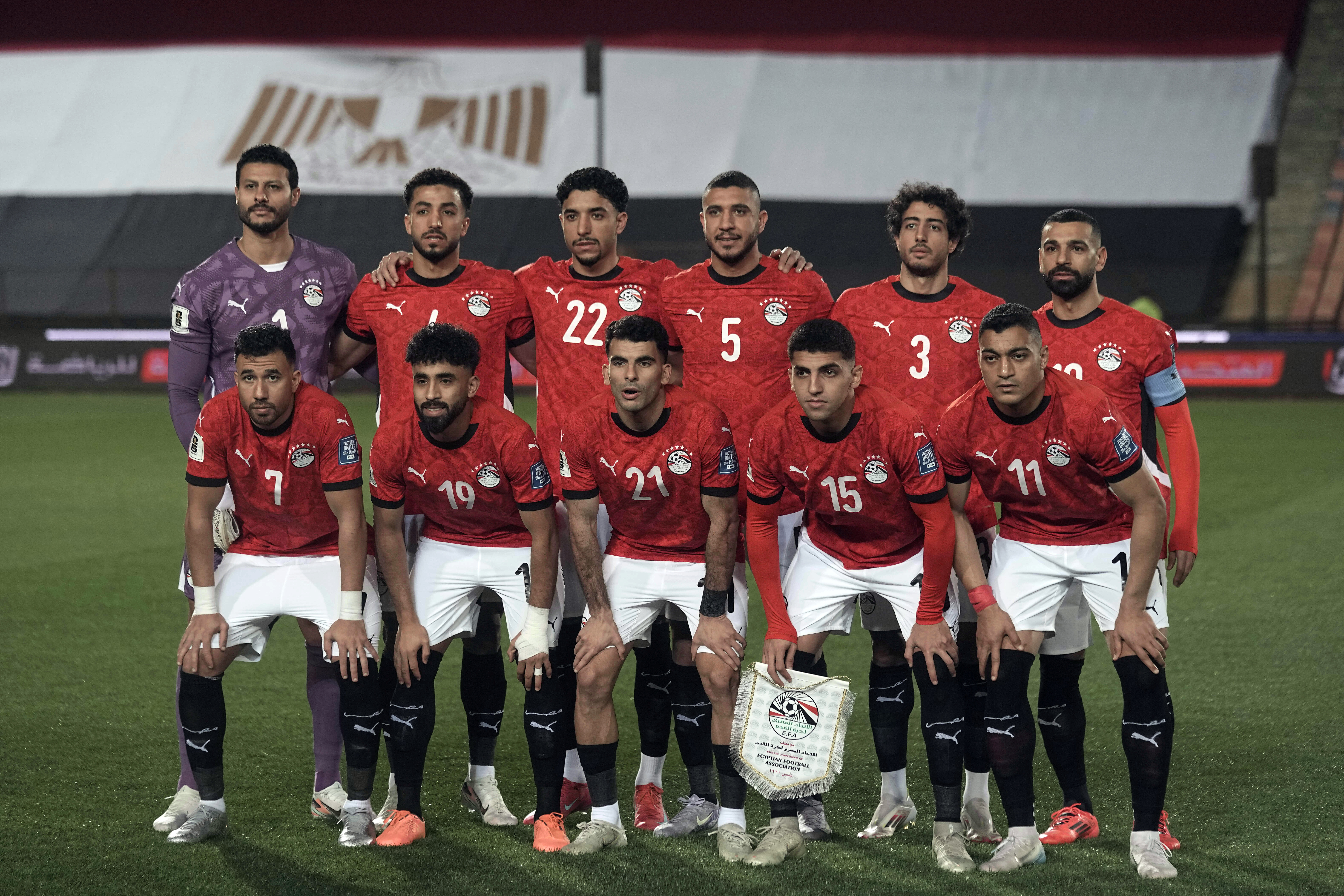 Egypt's national team soccer players pose for a group picture before their match with Sierra Leone in the World Cup 2026 qualifying soccer match at Cairo International Stadium, Egypt, Tuesday, March 25, 2025. (AP Photo/Amr Nabil)