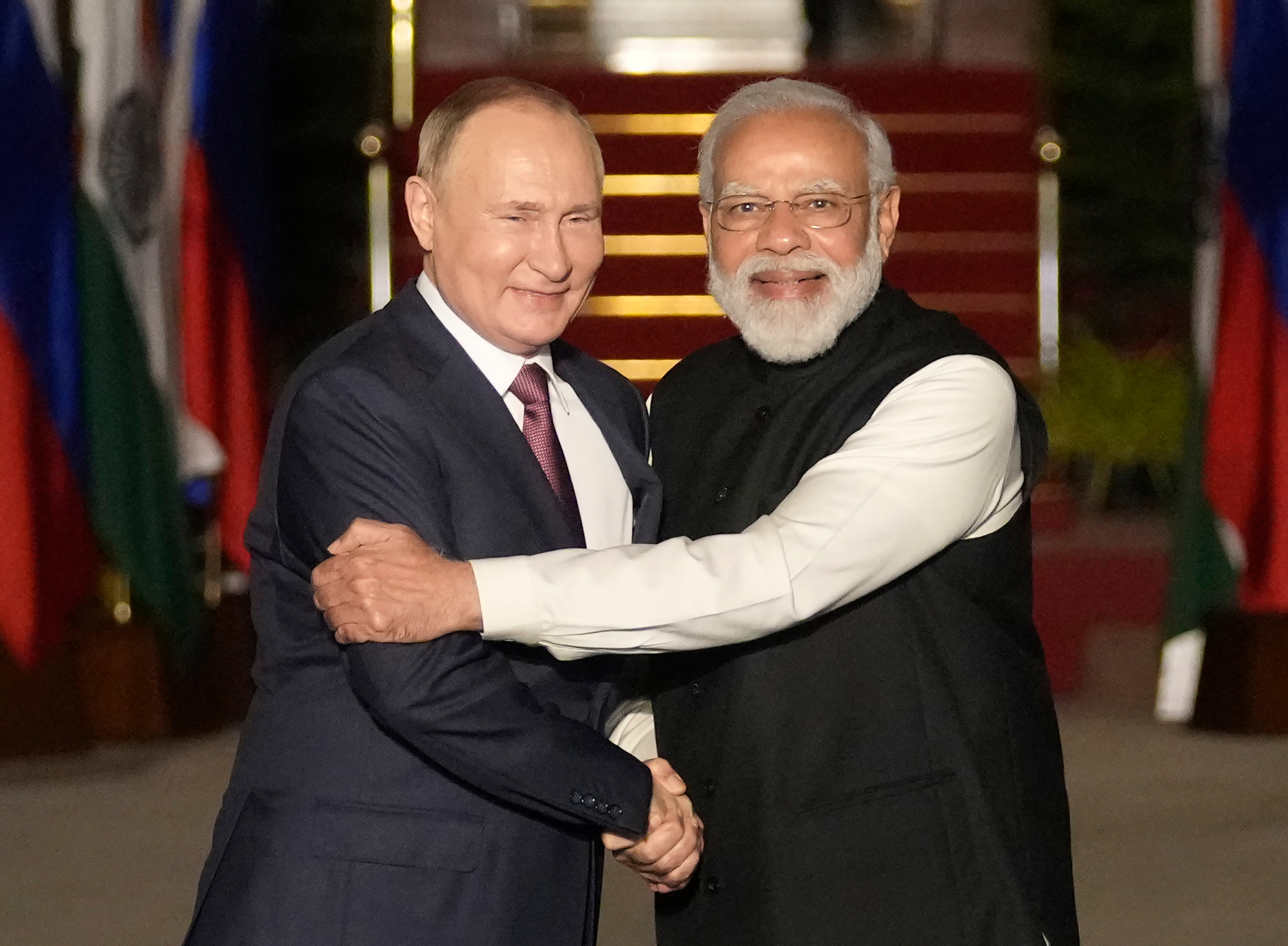 FILE - Russian President Vladimir Putin, left, and Indian Prime Minister Narendra Modi greet each other before their meeting in New Delhi, India, on Dec. 6, 2021. (AP Photo/Manish Swarup, File)